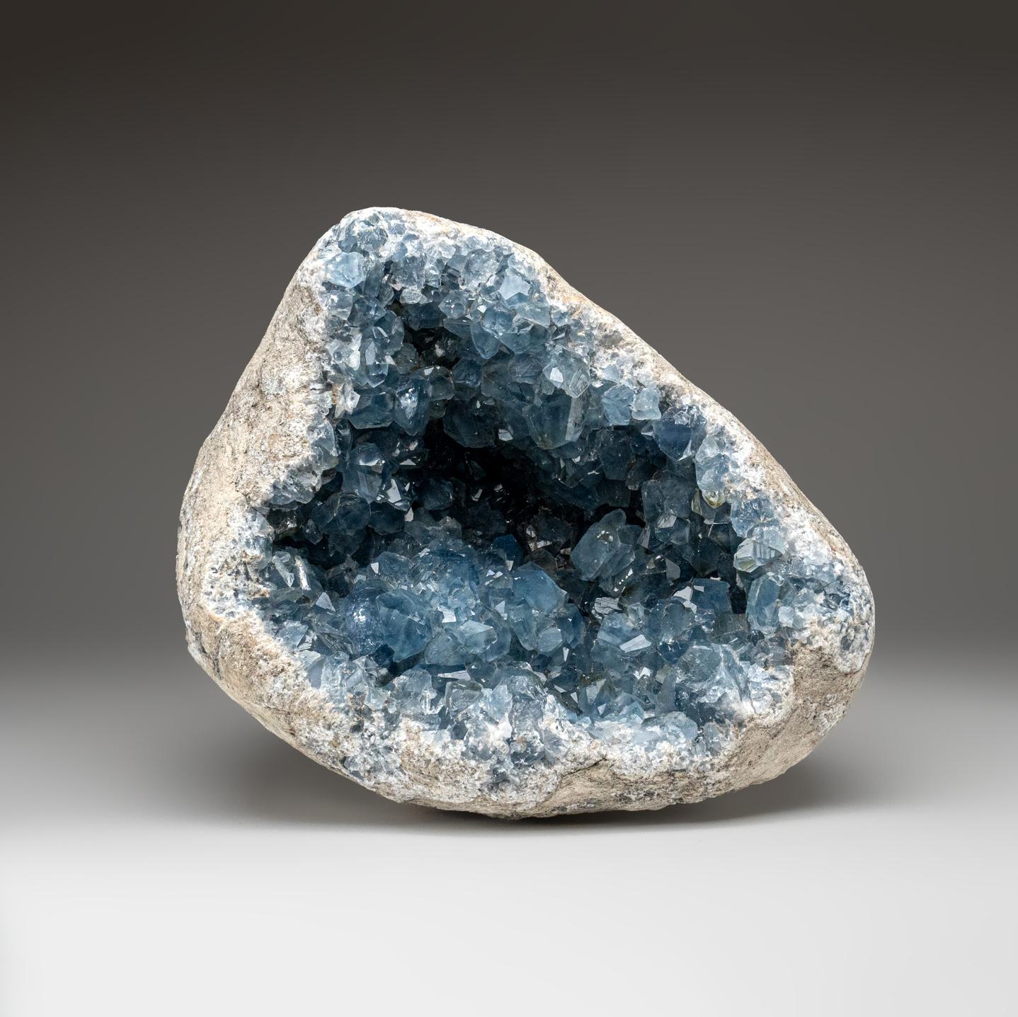 This unique Madagascan Blue Celestite Cluster exhibits large, gem crystals of remarkable quality, featuring prism faces and sharp chisel-terminations - surpassing the average blue-grey grains from the region. All shiny crystals are glassy and boast