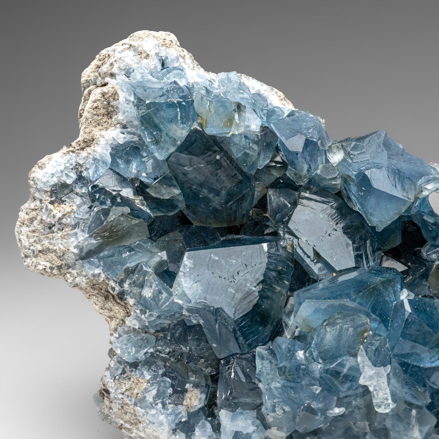 This unique Madagascan Blue Celestite Cluster exhibits large, gem crystals of remarkable quality, featuring prism faces and sharp chisel-terminations - surpassing the average blue-grey grains from the region. All shiny crystals are glassy and boast