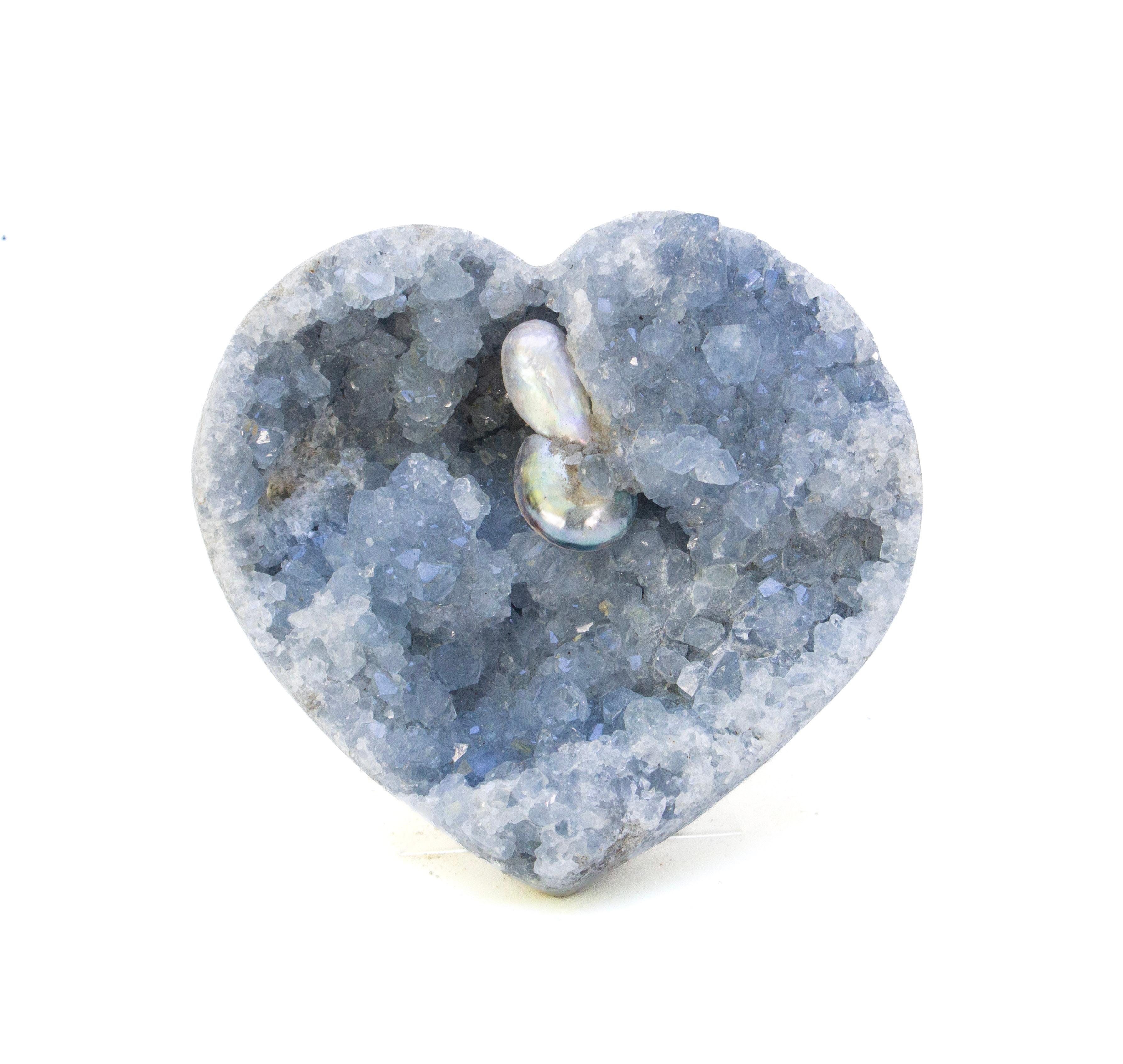 Blue heart-shaped celestite geode adorned with coordinating naturally forming baroque pearls.

The name for this specific geode is derived from the Latin word Caelestis, meaning 