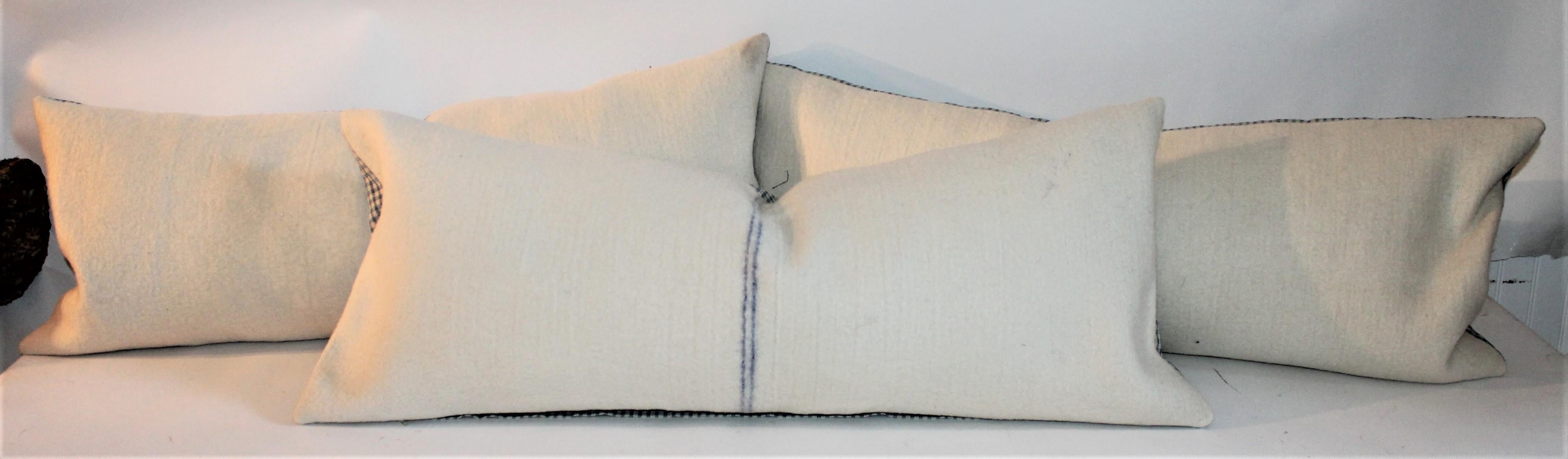 Set of three lambs wool pillows sold as individuals. With linen blue and white checked linen backing. The linen backing and the lambs wool textile are vintage textiles made into three pillows. Each pillow is sold individually at 895 or three for