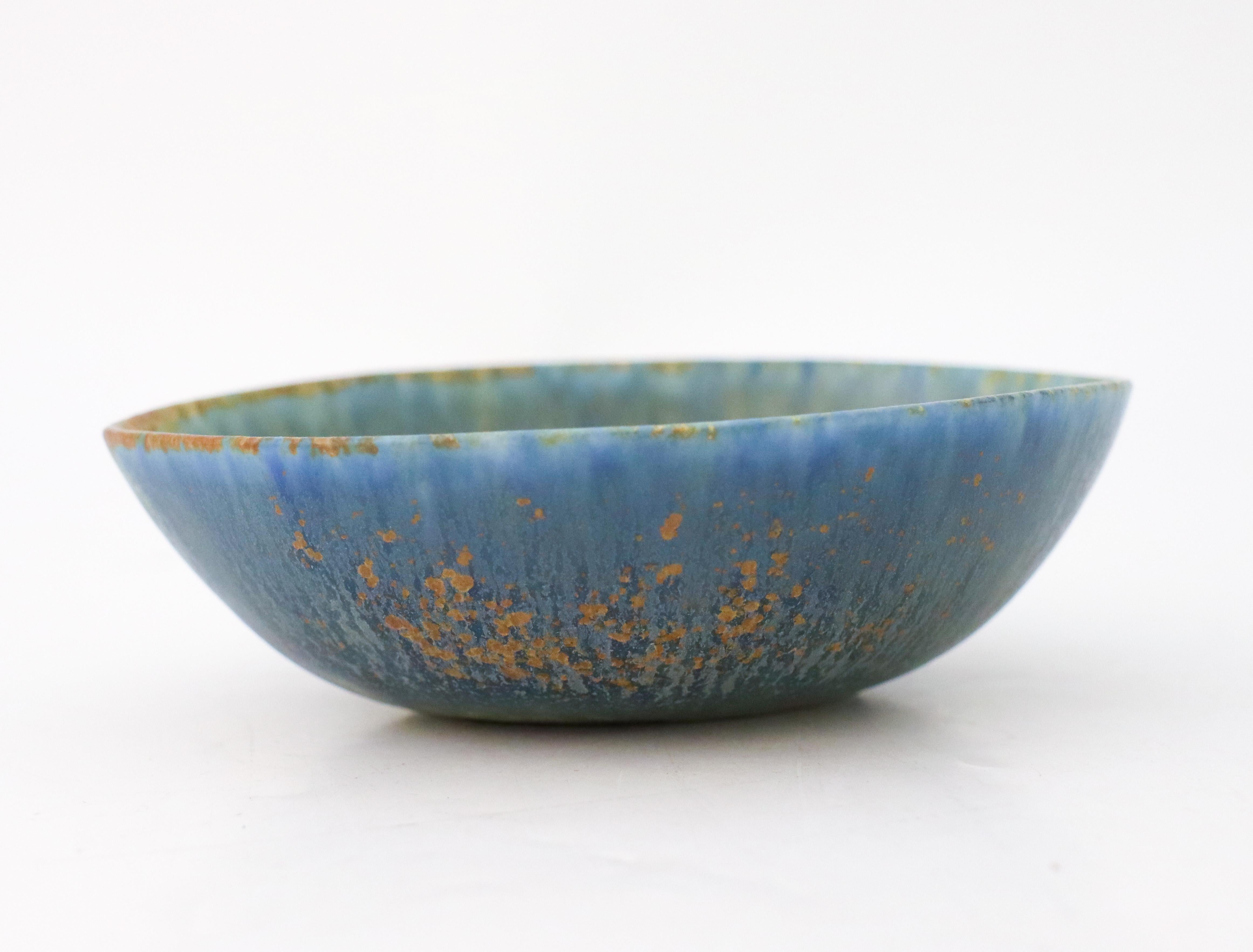 A lovely blue bowl designed by Carl-Harry Stålhane at Rörstrand, the bowl is 14 x 11 cm in diameter. It is in excellent condition and marked as 1st quality. 

Carl-Harry Stålhane is one of the top names when it comes to Mid century Scandinavian