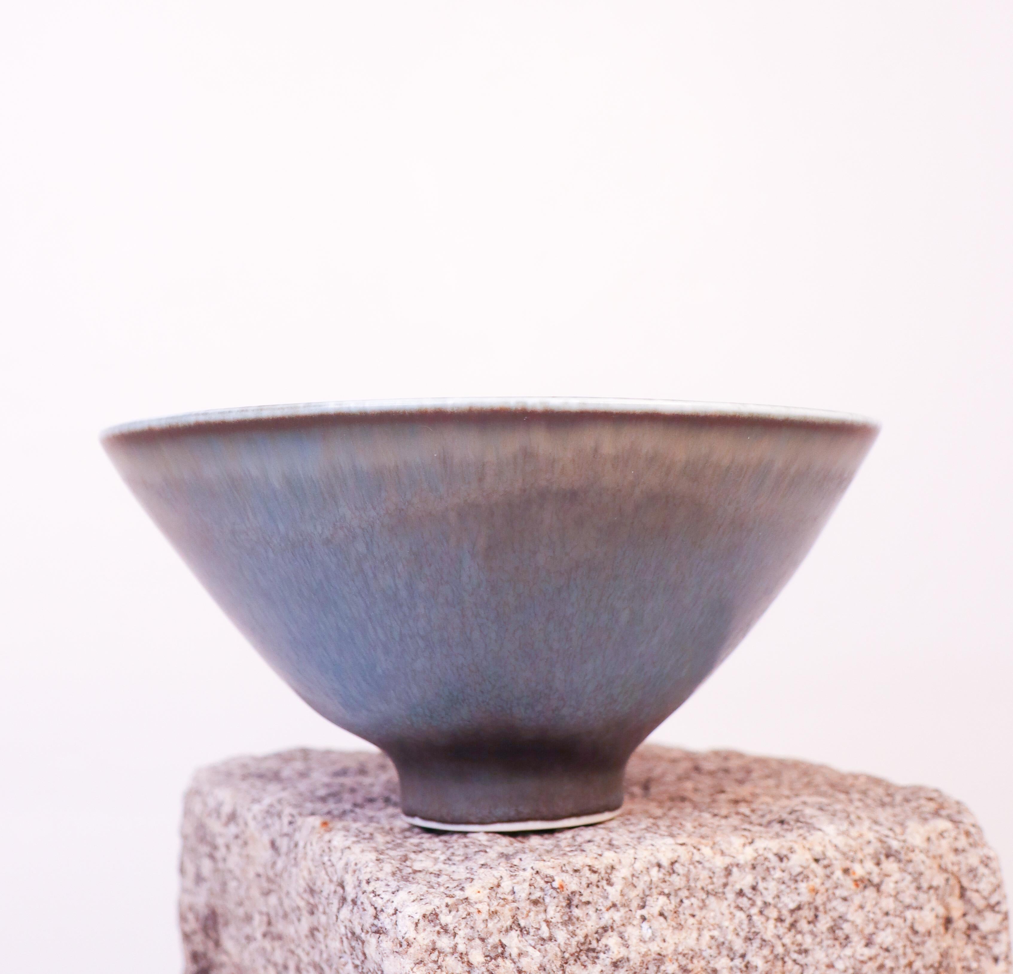 A lovely blue bowl designed by Carl-Harry Stålhane at Rörstrand, the bowl is 18,5 cm in diameter. It is in excellent condition but marked as 2nd quality. 

Carl-Harry Stålhane is one of the top names when it comes to Mid century Scandinavian