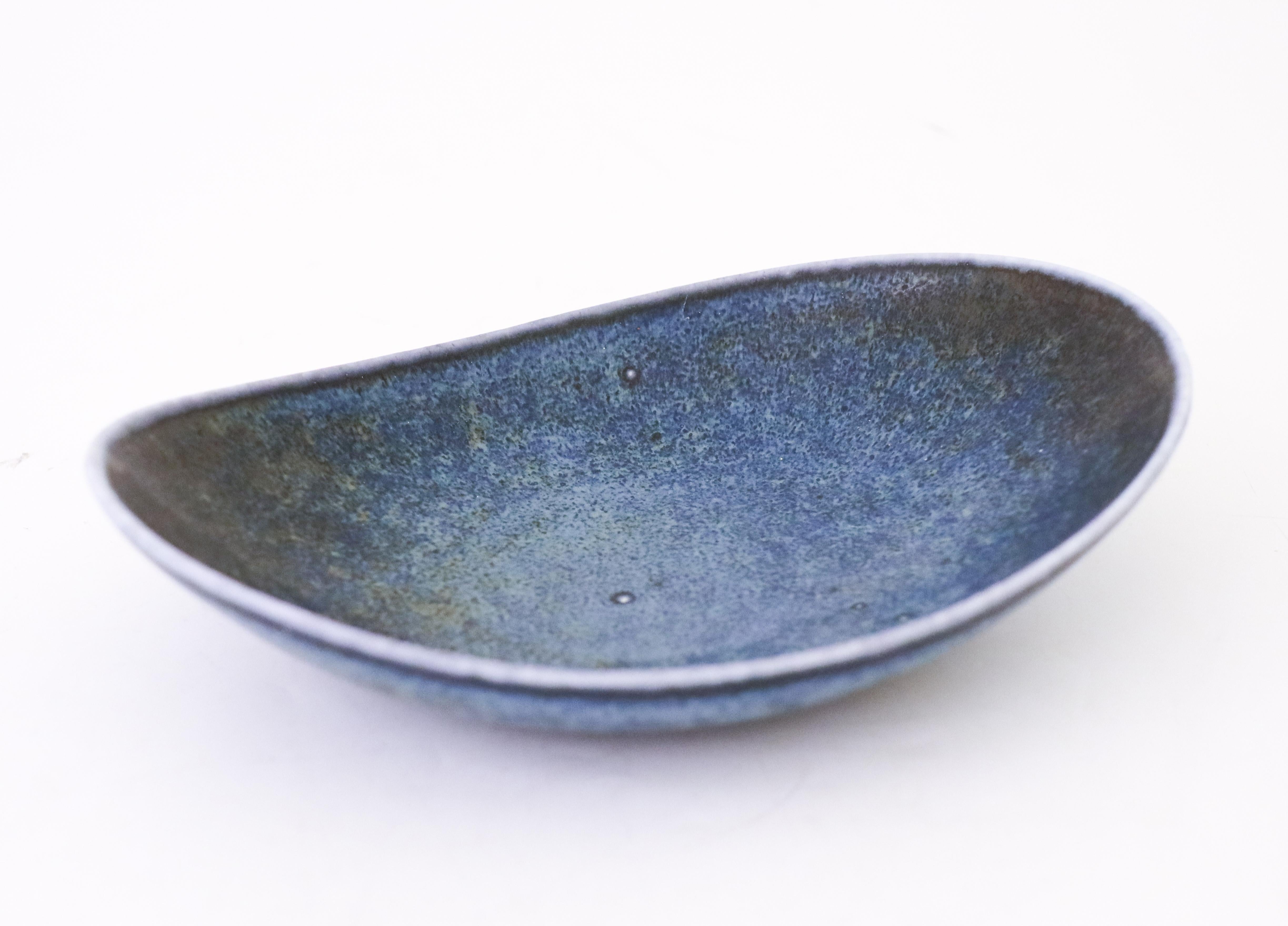 A lovely blue bowl designed by Carl-Harry Stålhane at Rörstrand, the bowl is 19 x 13.5 cm in diameter. It is in excellent condition except from some minor marks on the inside. The bowl is marked as 1st quality. 

Carl-Harry Stålhane is one of the
