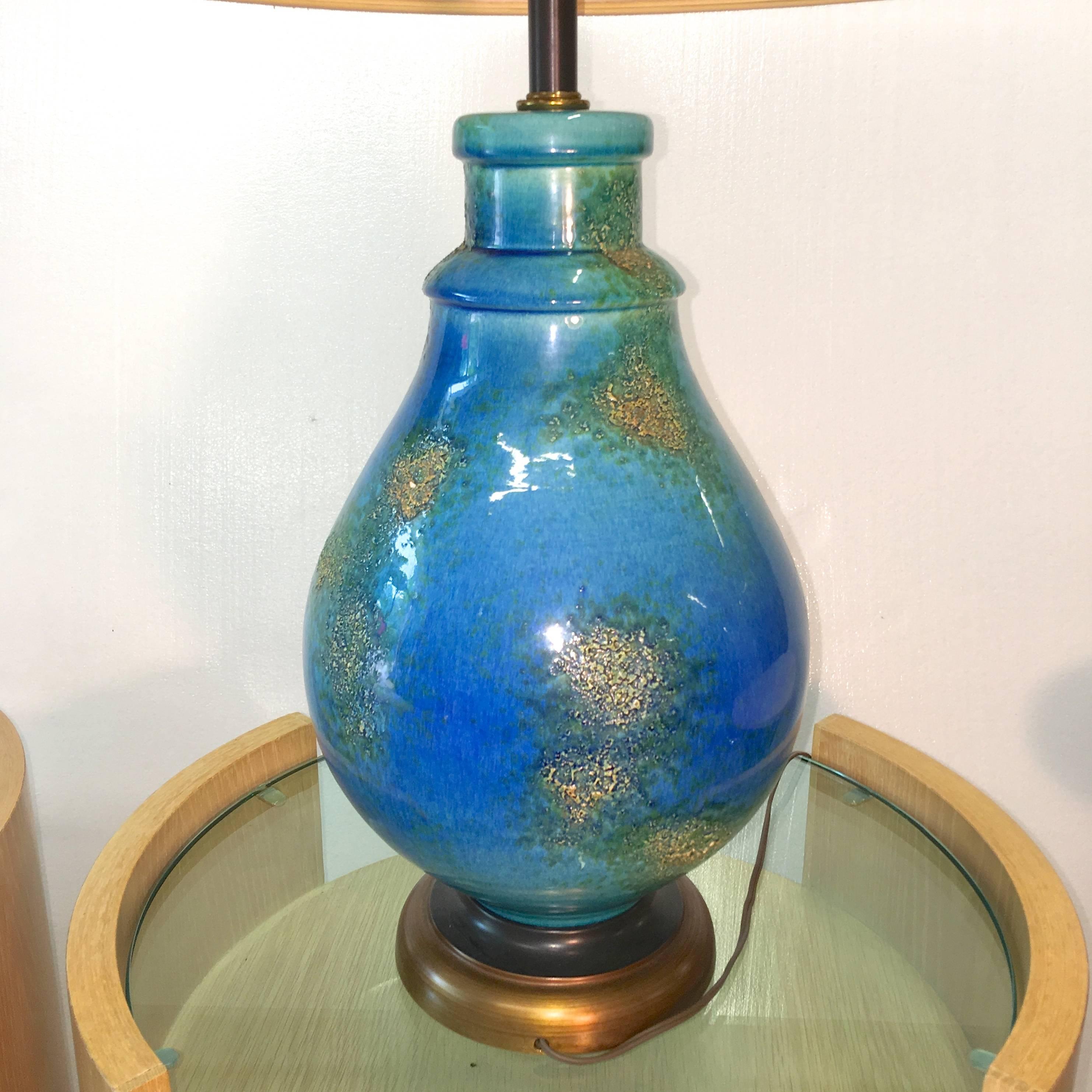 Glazed blue textured ceramic lamp, circa 1958. Great color and form. 

If requested we can ship with the original drum shade which had a blue ribbon band.

Blue ceramic vase is 10 inches diameter.

21 inches high to the base of the bulb