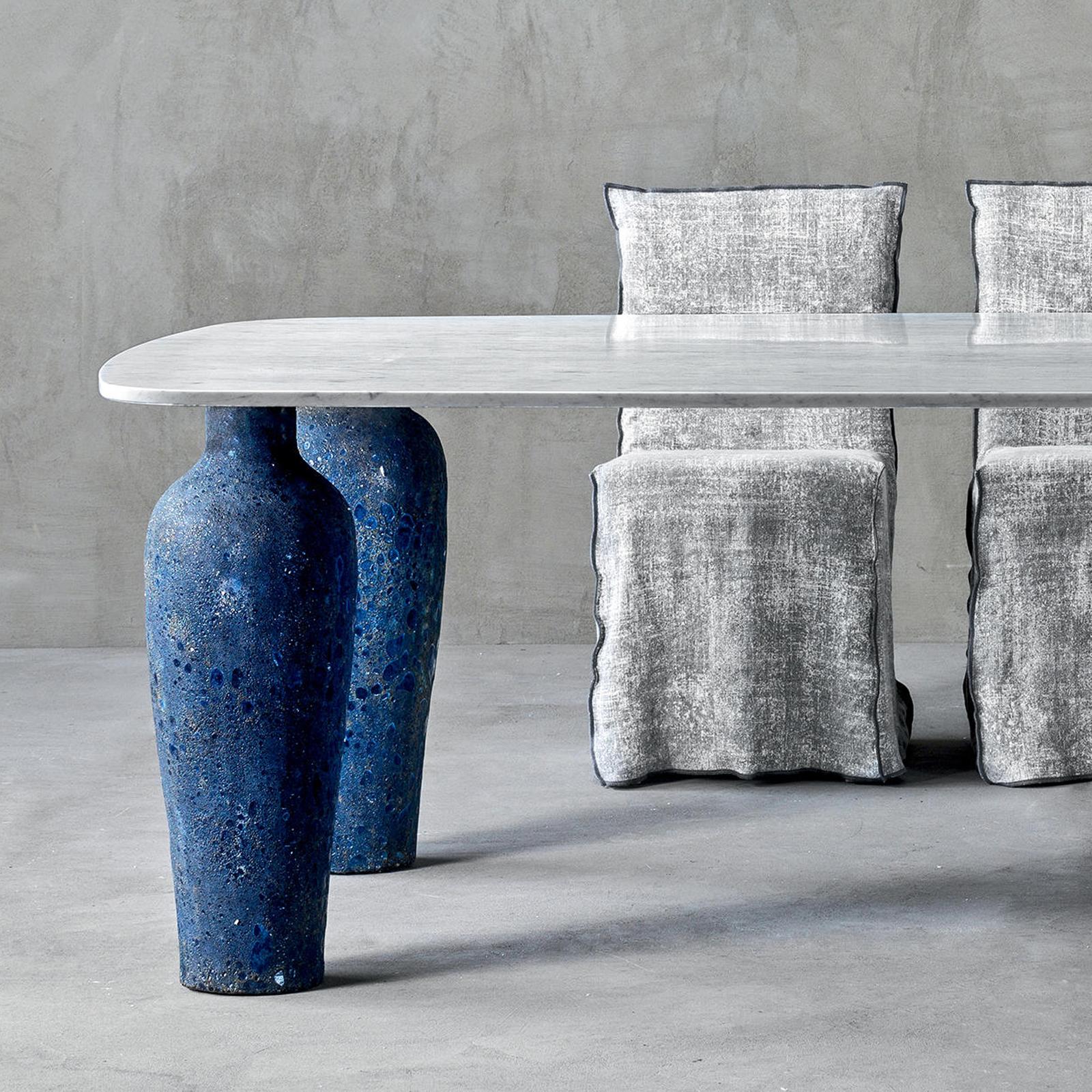 Dining table blue ceramic long with Carrara white and
grey marble top and with 4 vase feet in blue ceramic made
in Italy.