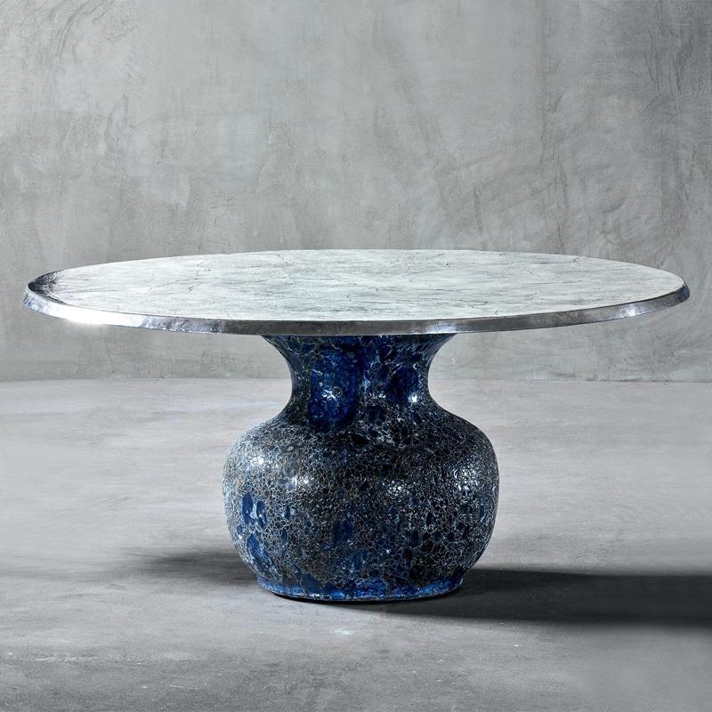 Round table blue ceramic with
handcrafted blue ceramic base. Top
in aluminium fusion. Available in:
Diameter 160 x height 74 cm, price: 10900,00€.
Diameter 130 x height 74 cm, price: 9400,00€.
Also available in blue ceramic low centre
table or side