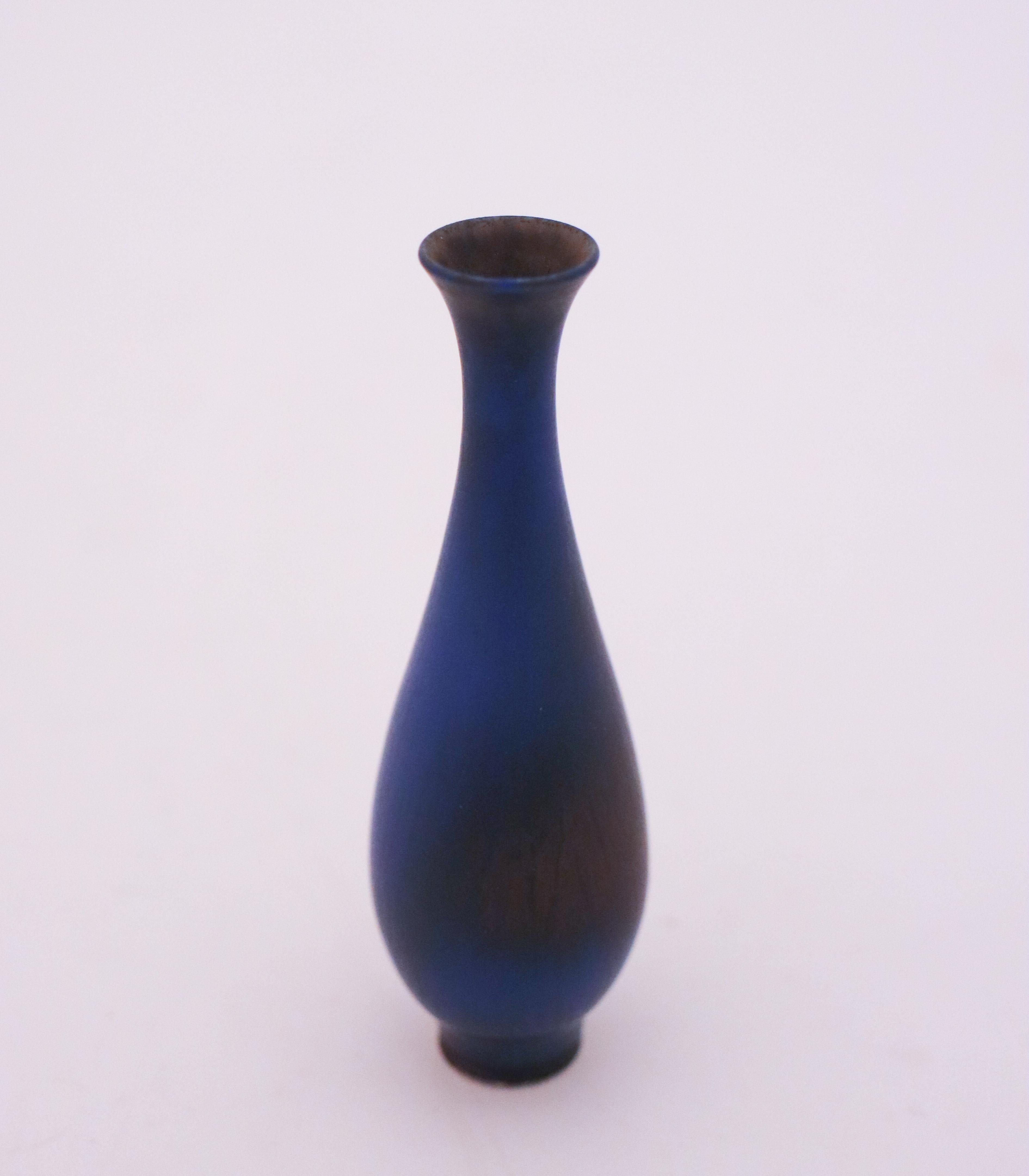 A lovely blue vase designed by Berndt Friberg at Gustavsberg in Stockholm, the vase is 9.5 cm high with a lovely harfur glase. It ´s marked as on picture and was made in 1961 and it is in mint condition.