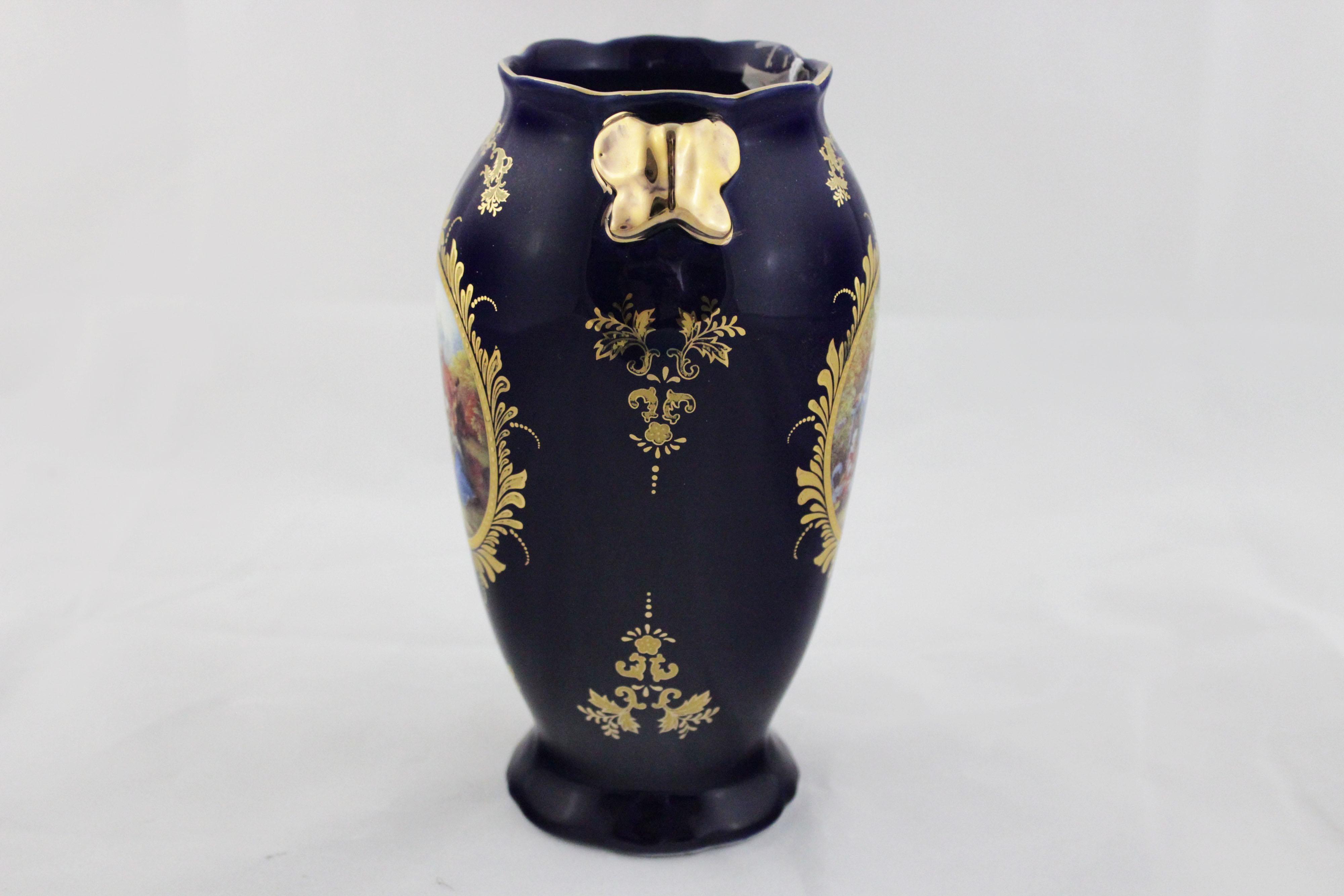 Blue ceramic vase with gilded decorations and roundels depicting court life. It dates from the time of Napoleon III, late 19th century. This vintage piece is in near original condition.
