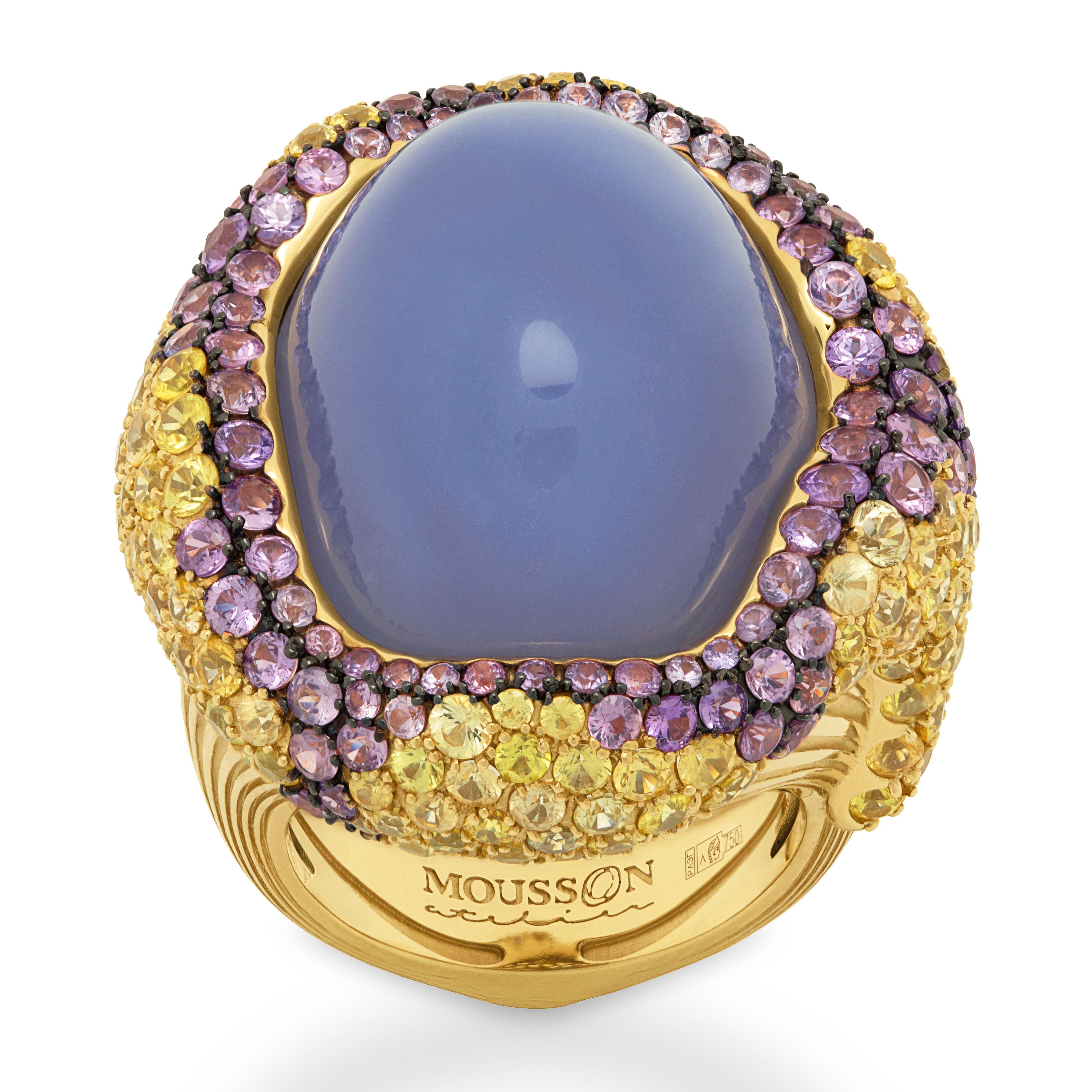Blue Chalcedony 32.10 Carat Yellow Purple Sapphires 18 Karat Yellow Gold Ring
Absolutely spectacular Blue Chalcedony Cabochon-shape weighing 32.10 Carat in our Ring from 