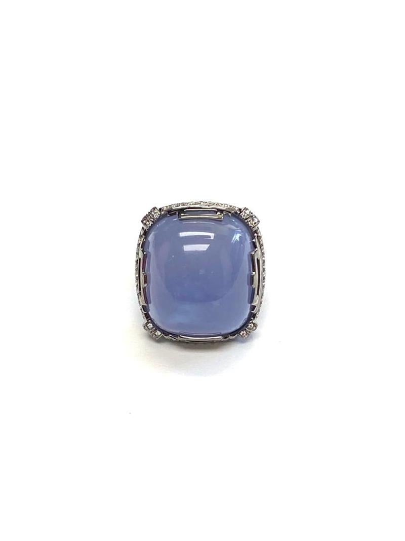 Blue Chalcedony Large Cushion Cabochon Ring with Diamond in 18k White Gold, from 'Rock 'N Roll' Collection

Stone Size: 21.50 x 19.50 mm

Gemstone Weight: 31.86 Carats

Diamond: G-H / VS, Approx Wt: 0.97 Carats
