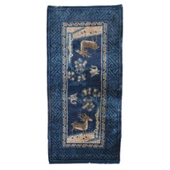 Tapis pictural chinois à motif d'animal bleu