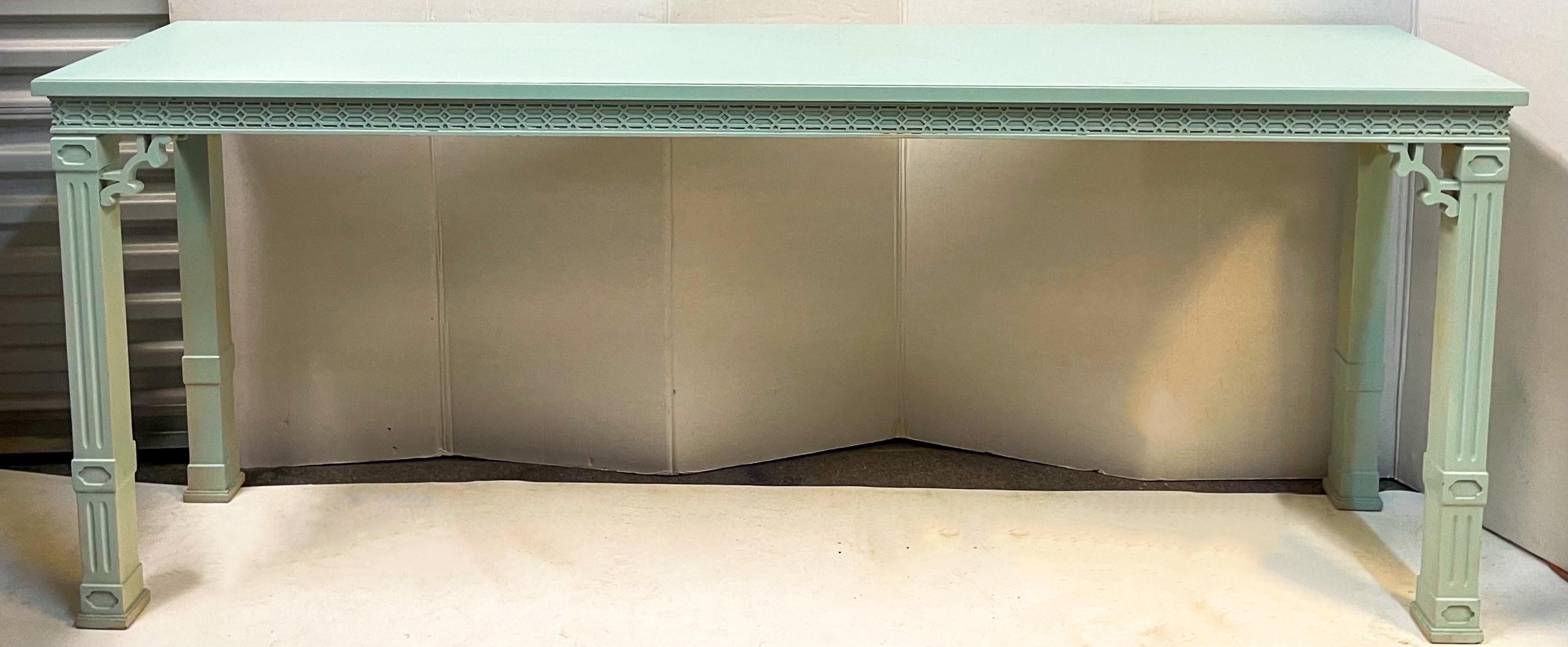 This is a robin’s egg blue painted Chinese chippendale style console table by Erwin Lambeth. There are two for someone looking for a pair. The paint is a more recent addition. They date to the 1970s. Note: photos are showing some light reflecting