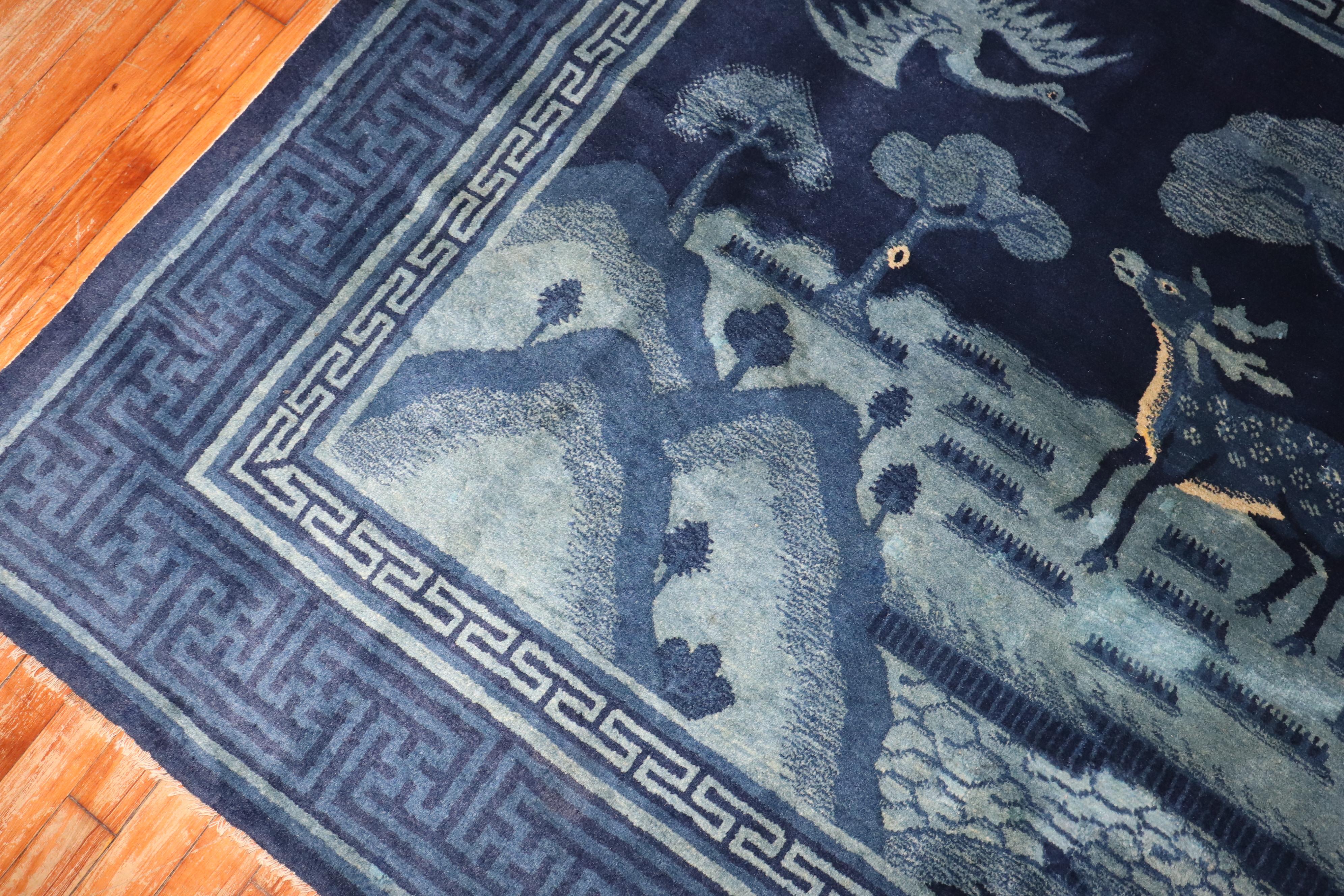 
early 20th century blue chinese peking rug with a deer and flying bird

rug no.	j3395
size	4' 10