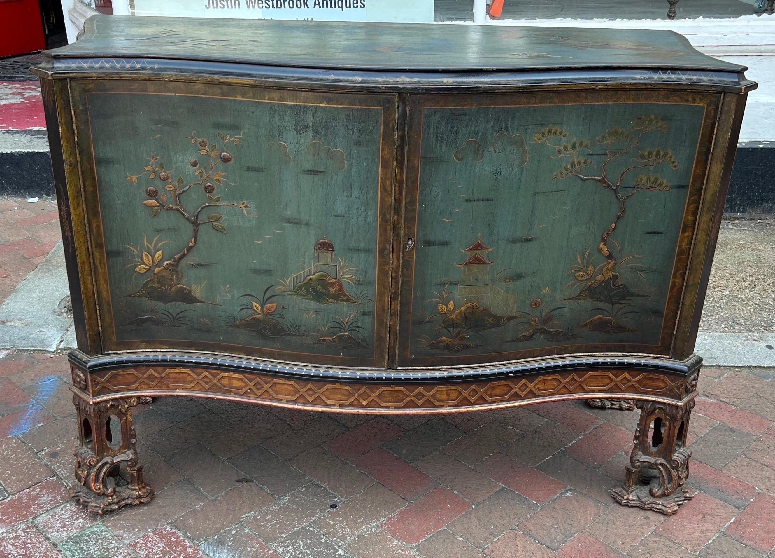 Gorgeous blue chinoiserie decorated cabinet on Chinese chippendale style feet. Great color and depth with very well done raised chinoiserie decoration.

Great as a cabinet or would make an incredible bathroom vanity.