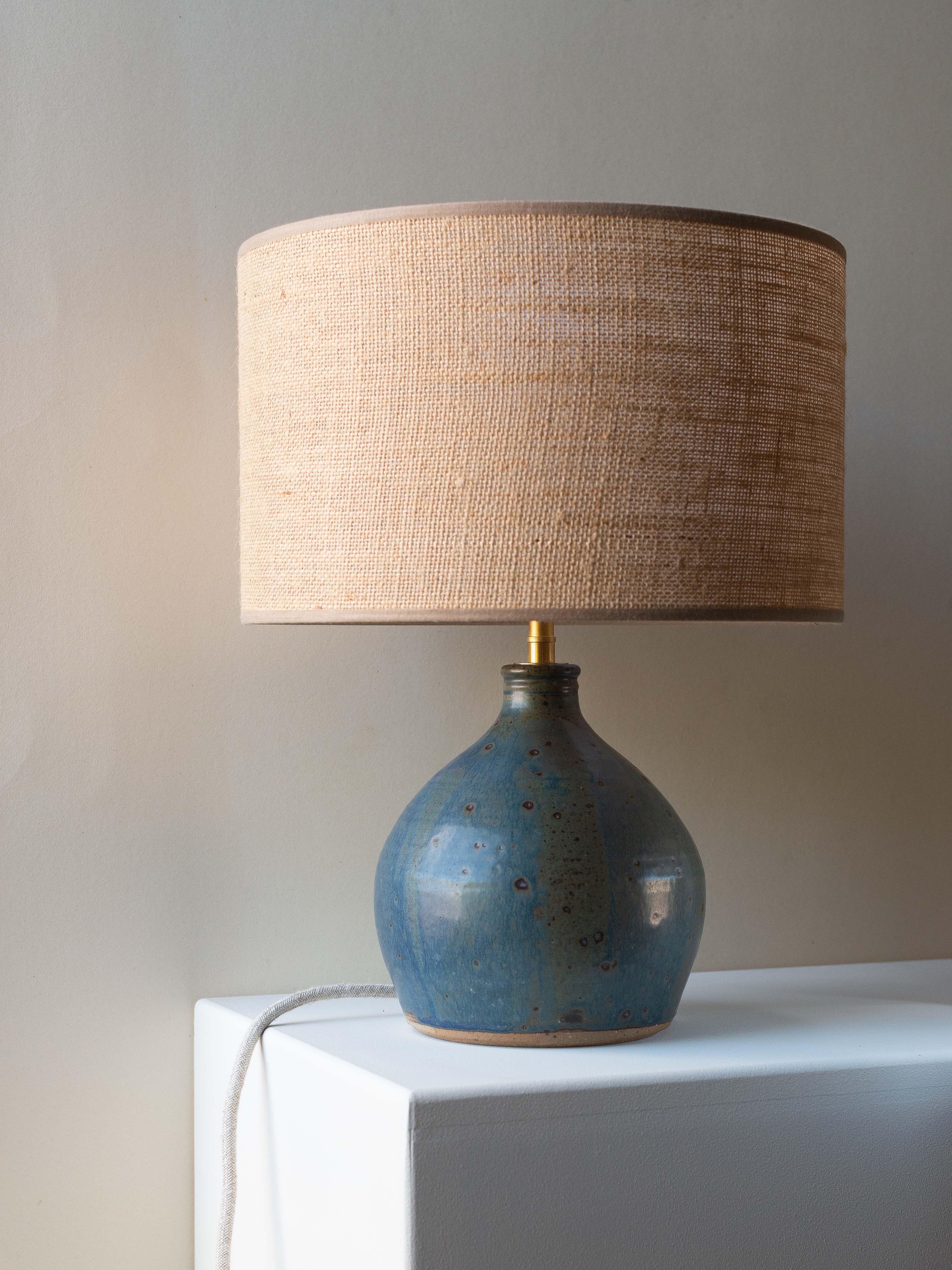Blue Clay Table Lamp Mid-Century Modern France 1960s

This lamp base from the 1960s is a French artisanal work made of sandstone/clay.

Its surface is covered in a blue pyrite enamel, creating a unique effect of small spots of various sizes. 

This