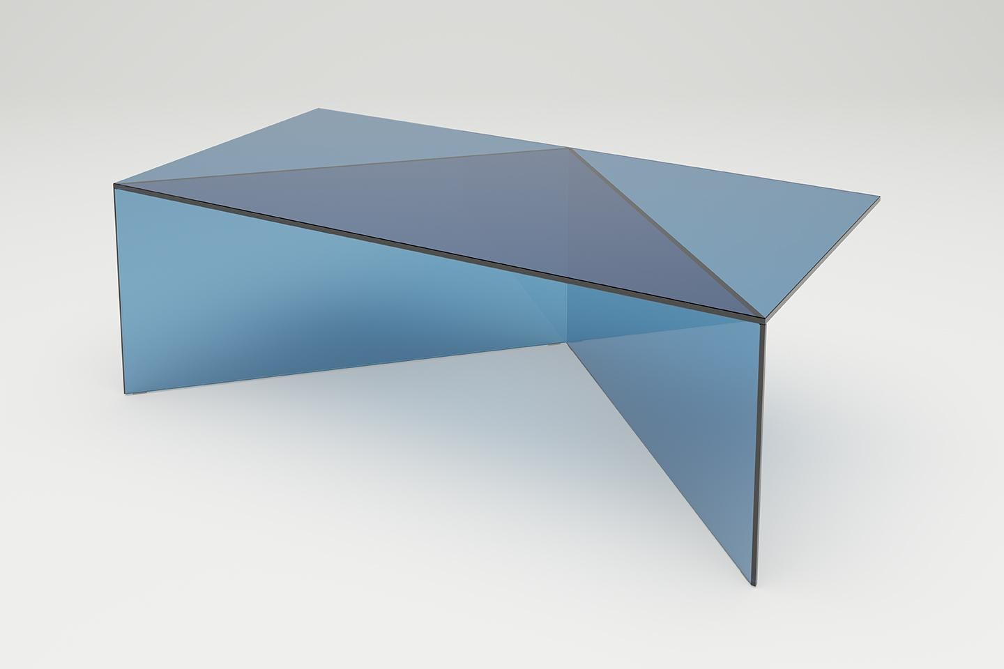 Blue Clear glass poly oblong Coffe table by Sebastian Scherer
Dimensions: D120 x W60 x H40 cm
Materials: Solid coloured glass.
Weight: 34.4 kg.
Also Available: Colours:Clear white (transparent) / clear green / clear blue / clear bronze / clear