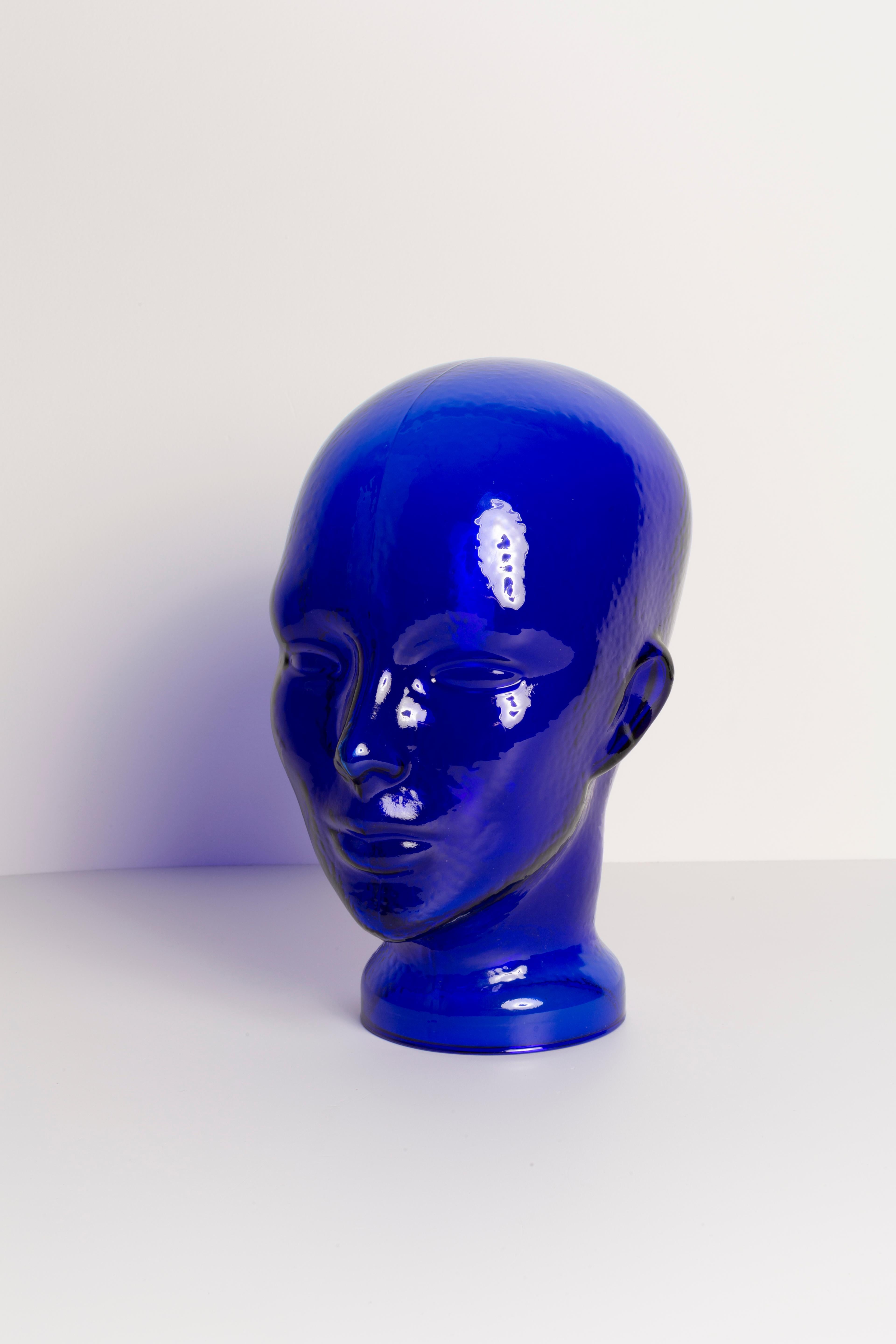 Life-size glass head in a unique deep blue color. Produced in a German steelworks in the 1970s. Perfect condition. A perfect addition to the interior, photo prop, display or headphone stand.