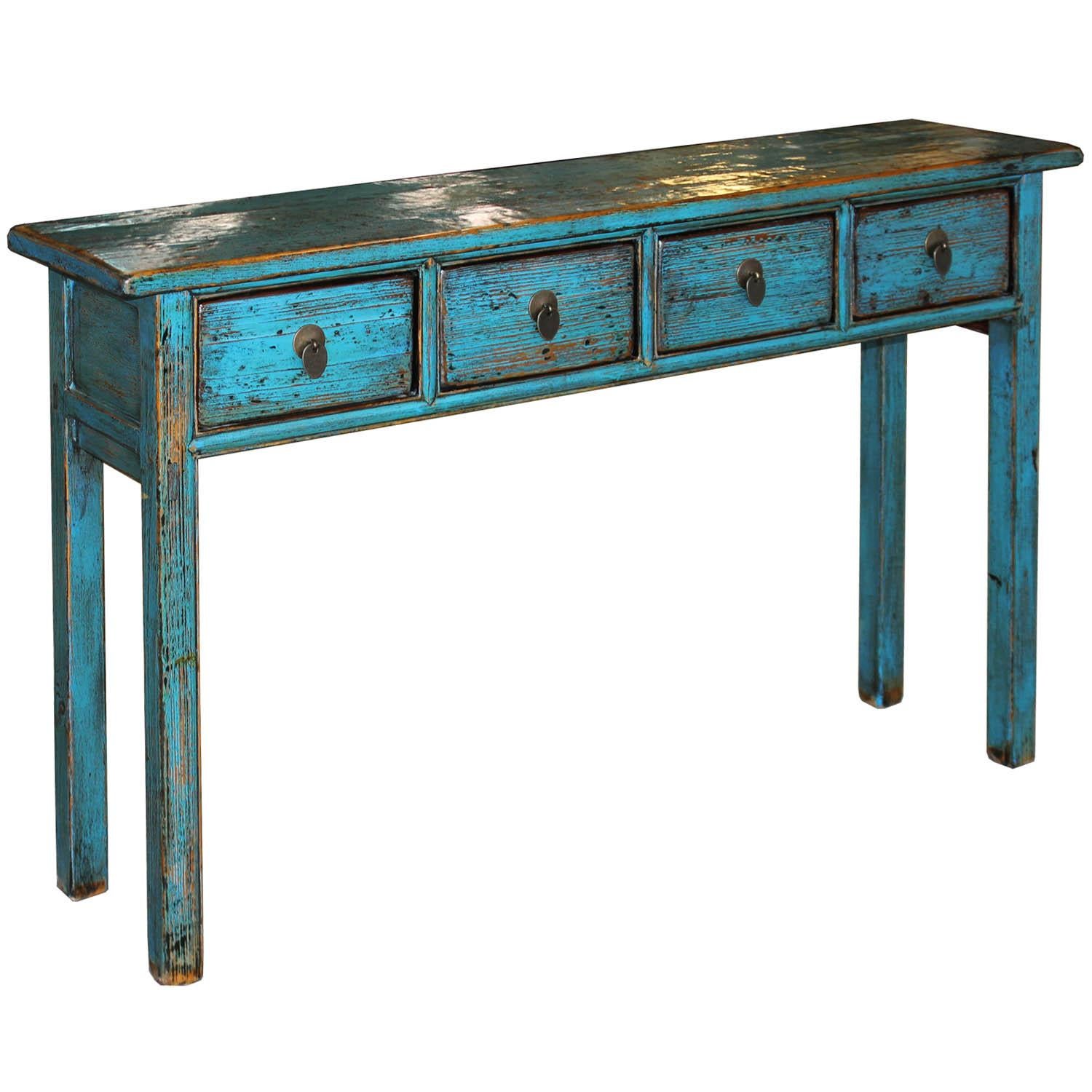 Vibrant blue lacquer console table with distressed exposed wood edges can be a pop of color in the living or dining room. Place behind a sofa or in the entry way.