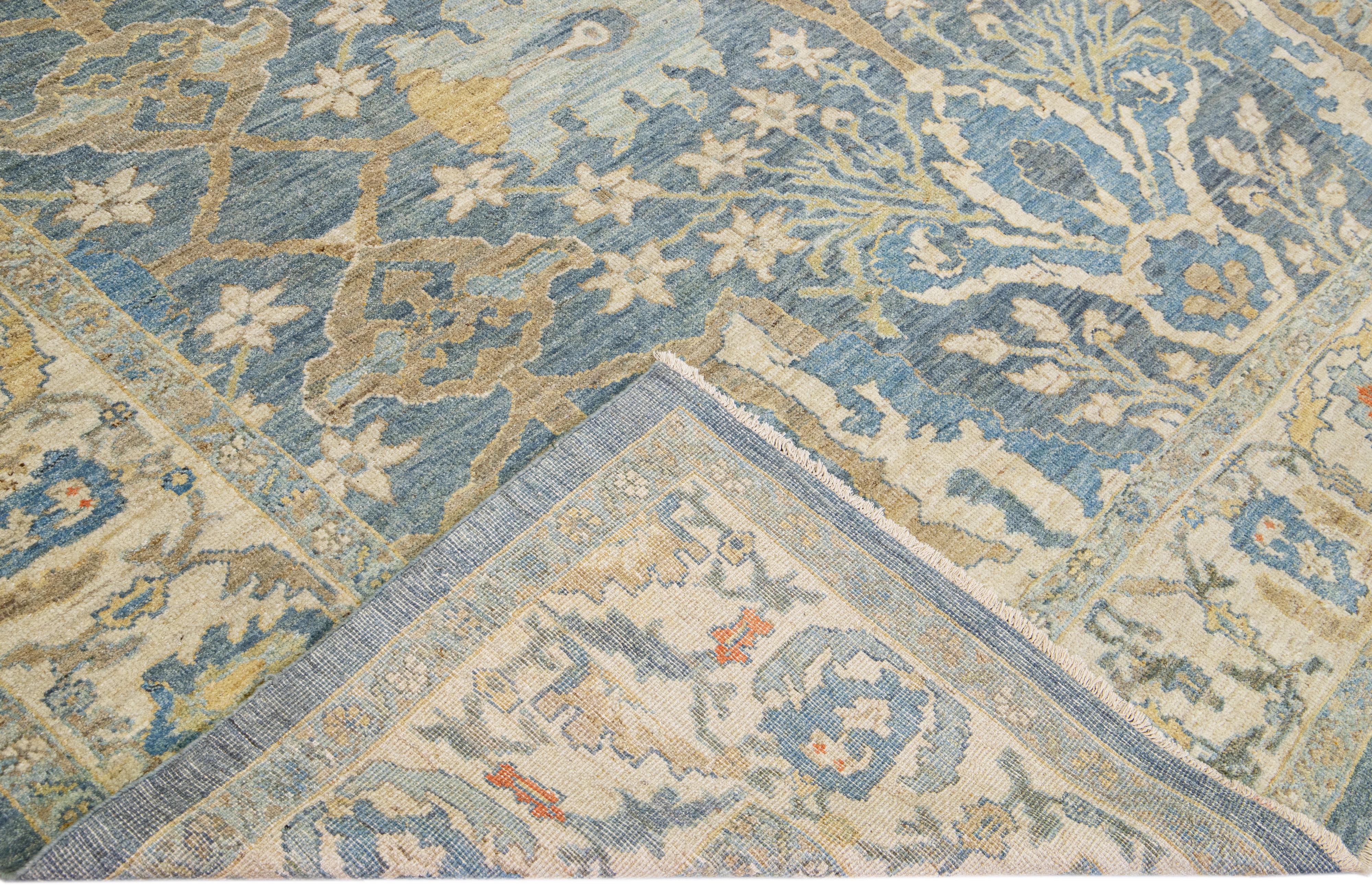 Beautiful modern Sultanabad hand-knotted wool rug with a blue field. This Sultanabad rug has a beige frame and multicolor accents in a gorgeous all-over classic floral pattern design.

This rug measures: 10'4