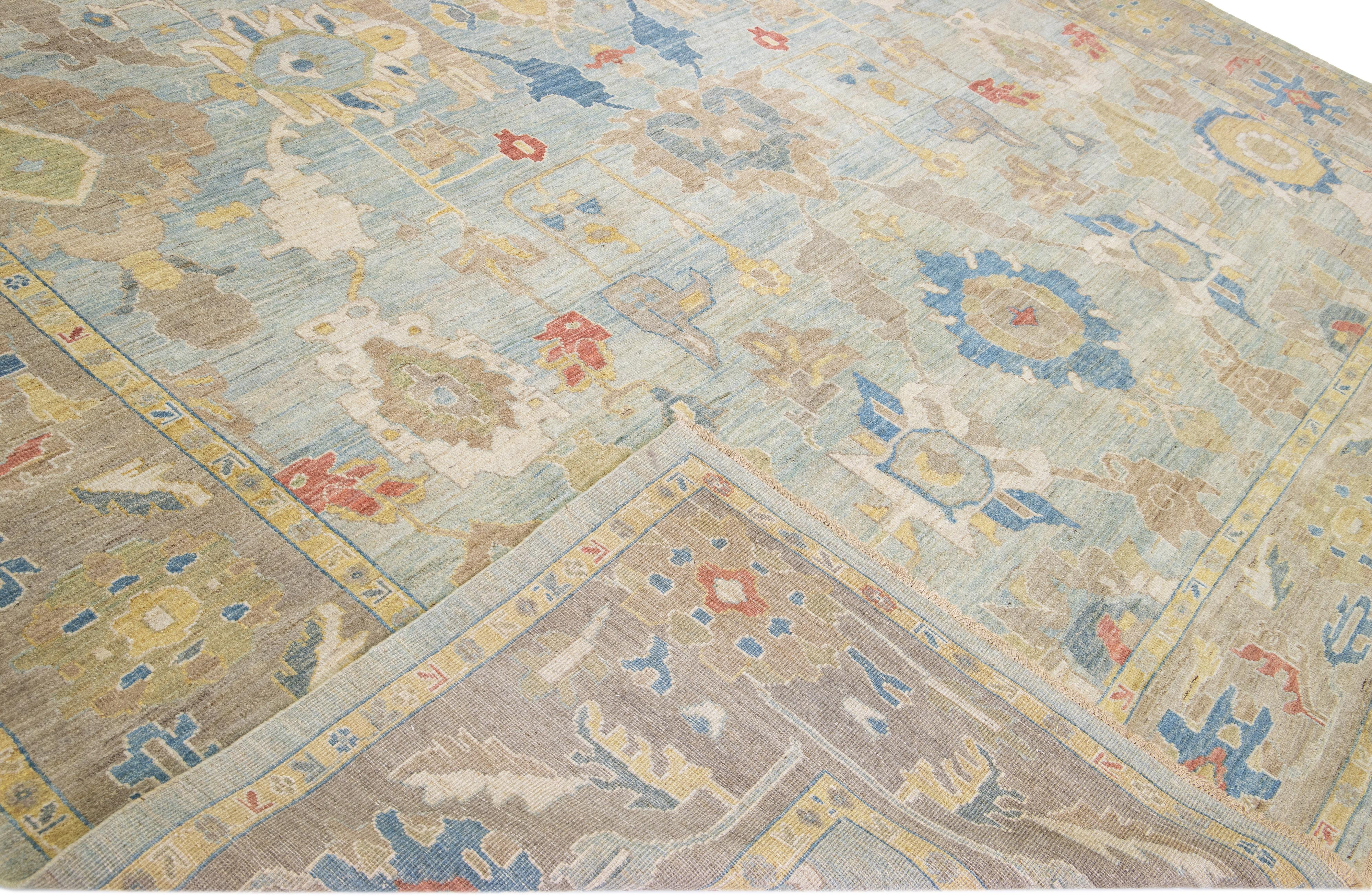 Beautiful modern Sultanabad hand-knotted wool rug with a blue field. This Sultanabad rug has a brown frame and multicolor accents in a gorgeous all-over classic floral pattern design.

This rug measures: 13
