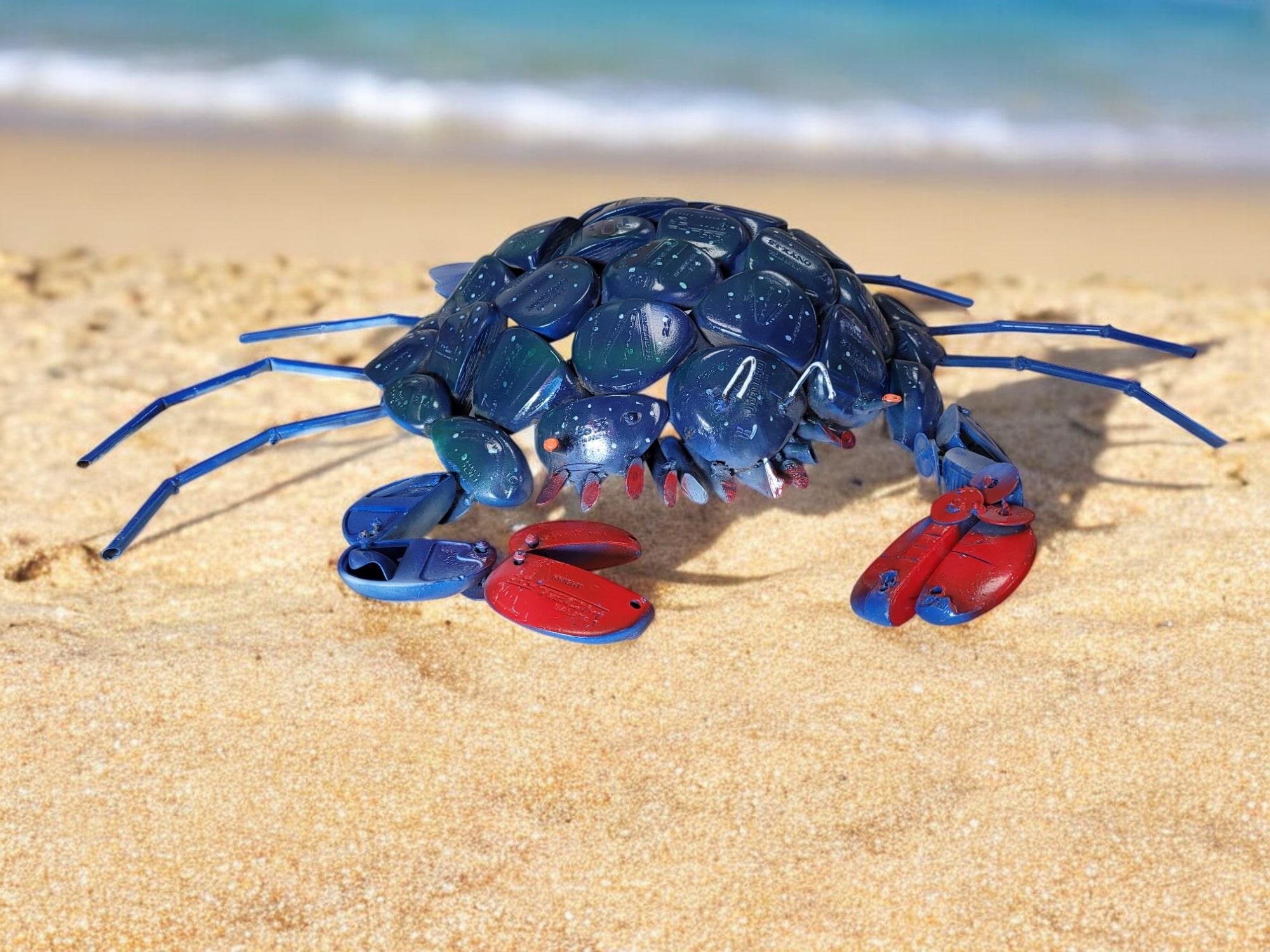 This one-of-a-kind Blue Crab sculpture is handcrafted from repurposed vintage golf clubs, making it a unique and sustainable work of art. Signed by the artist, this conversation piece is perfect for any coastal, eclectic, or nature-inspired