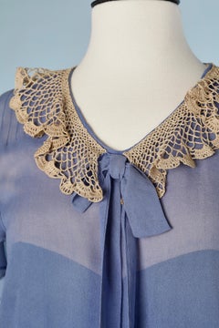 Blue crêpe top-stitched dress with crochet collar, bow and ruffles Circa 1925's