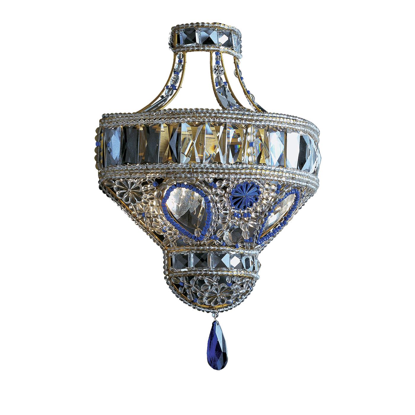 A delicate design crafted with masterful expertise, this sconce will add a luxurious accent to a classic decor. Flanking a mirror in an entryway or used to illuminate a living room or a bedroom, this piece will sparkle thanks to the clear and blue
