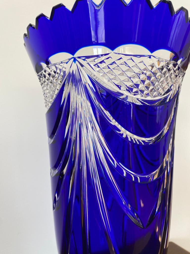 Beautifully deep blue crystal vase, from circa 60s'-70s'. This long footed vase is adorned with handcrafted drapery motifs.