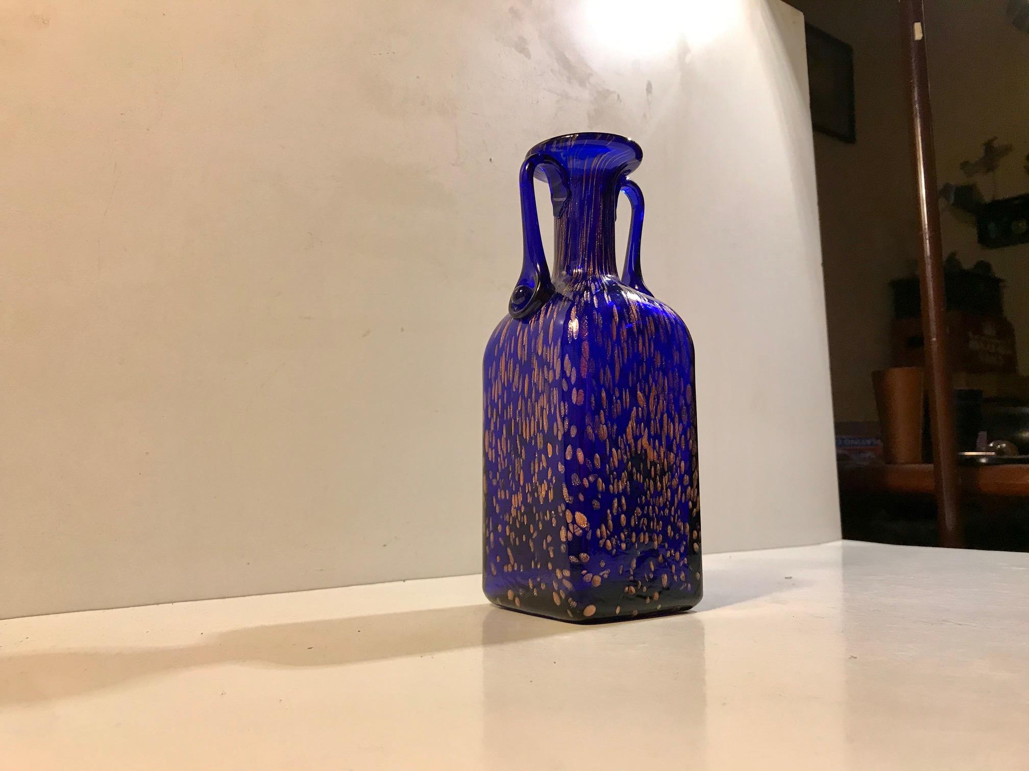 Mouth-blown blue crystal vase with stylized handles and rose gold speckles. Designed by Joska in Bavaria, Germany. Label Joska. Silberberg Kristall, Mundgeblassen, Waldglashütte.