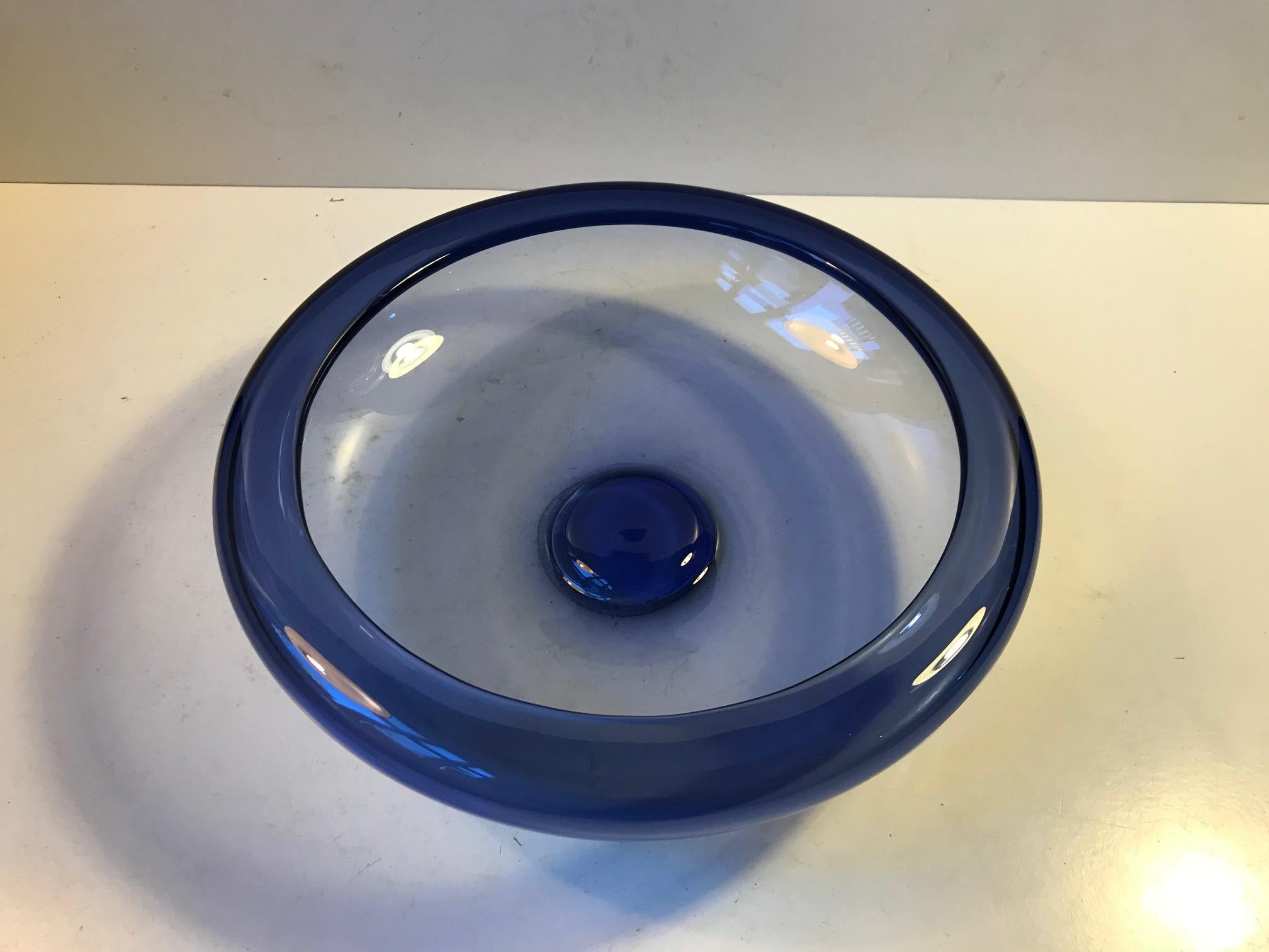 Handblown sapphire blue bowl designed by Per Lütken in 1955. This piece was manufactured at Holmegaard in Denmark during the mid-late 1960s. It is called Saphire Blue Provence and it is hand signed and numbered by the designer.