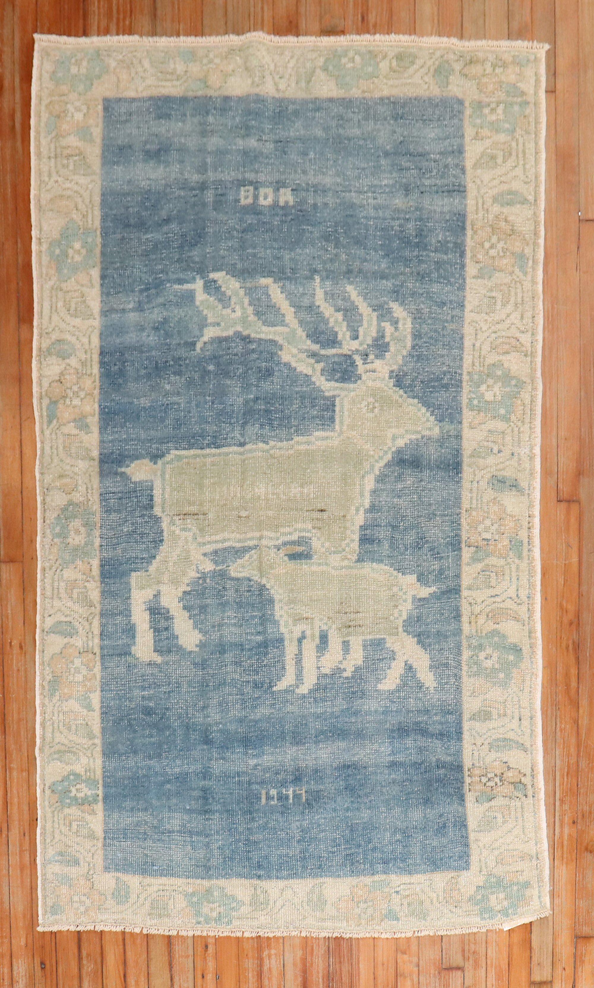 One of a kind hand-knotted Turkish Anatolian rug with 2 deers on a blue field. dated 1944

Measures: 4'1” x 6'6”.

  