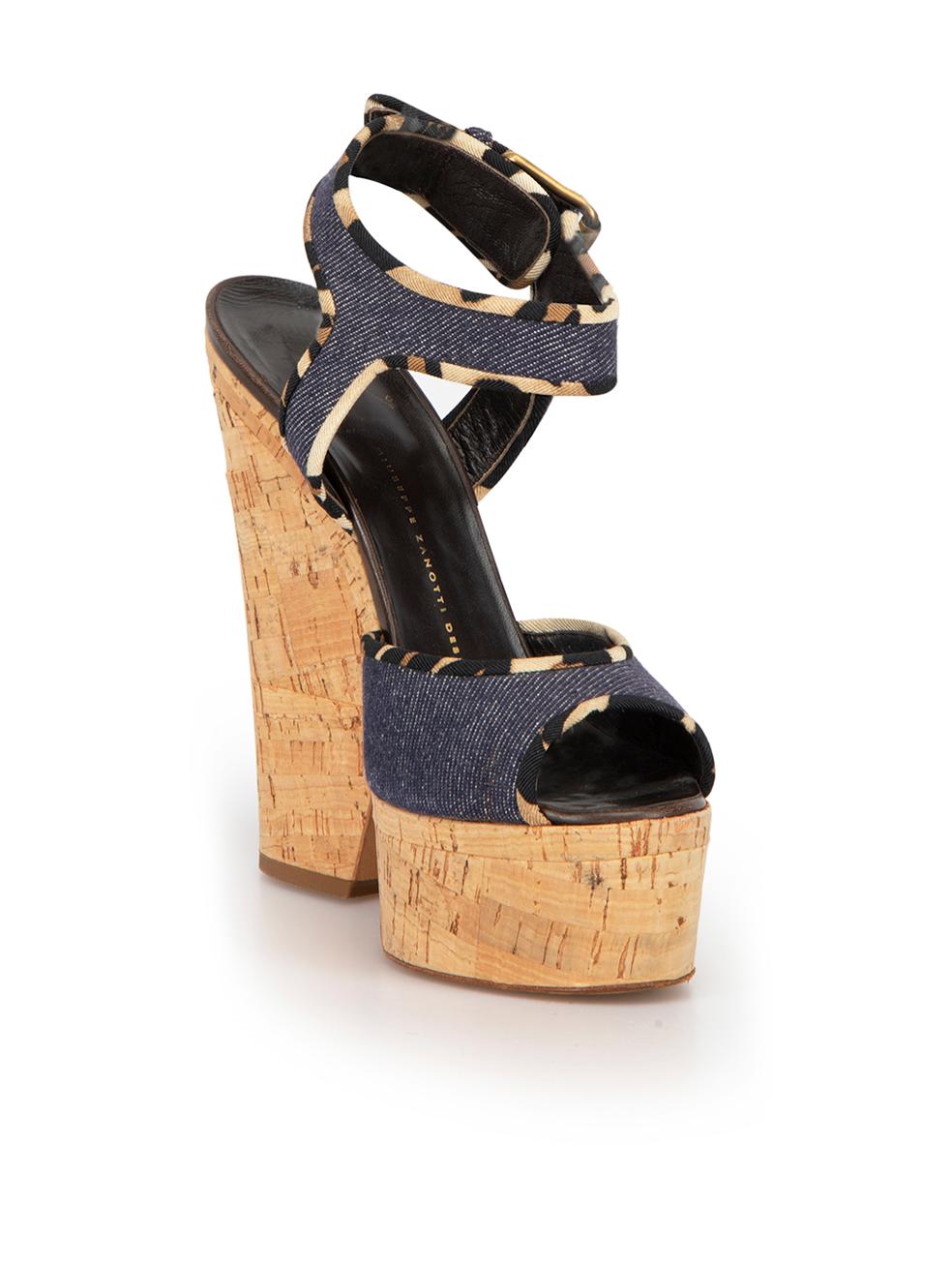CONDITION is Very good. Minimal wear to shoes is evident. Minimal wear to the leather trim at both heels with scuffing on this used Giuseppe Zanotti designer resale item. 



Details


Blue and Beige

Denim and Cork  

Platform Wedges

Peep