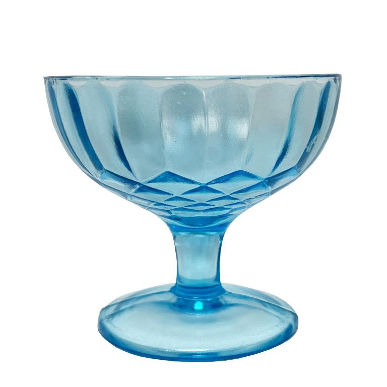 A set of three bright blue faceted antique depression glass champagne coupe glasses. A wonderful set that will add a pop of color to any bar. This set is in the difficult-to-find, 