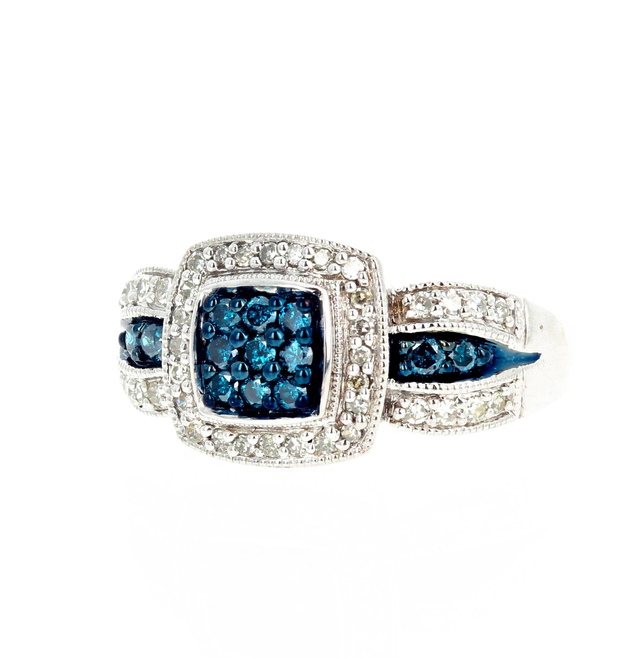 Glittering heat treated blue Diamonds (1 carat approximately) enhanced with brilliant glittering white Diamonds (1 carat approximately) set in rhodium plated sterling silver ring size 6 (sizable).  