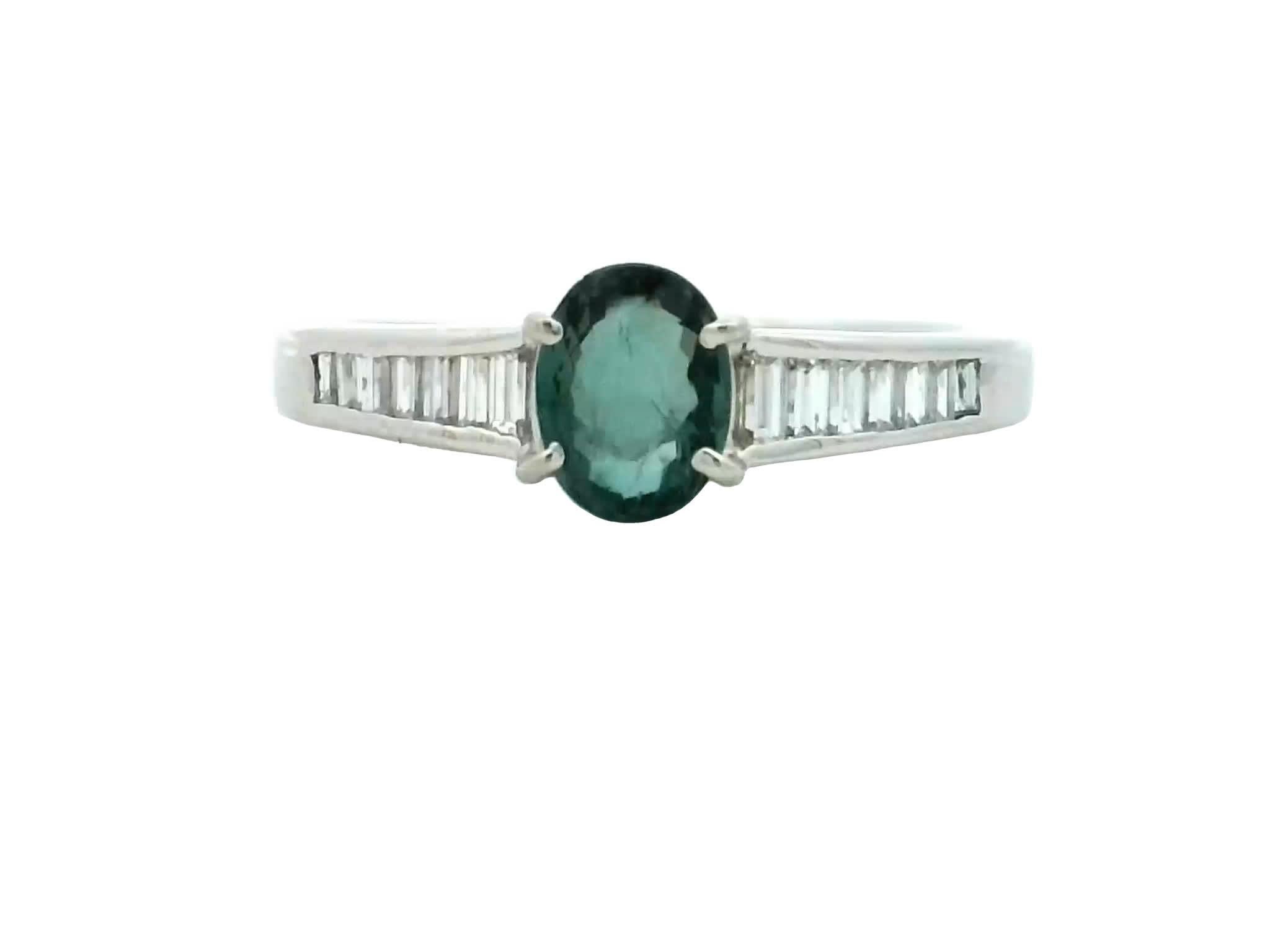 Introducing our exquisite Blue Diamond Ring with Baguettes, a true embodiment of elegance and sophistication. Crafted to perfection, this captivating piece showcases the mesmerizing allure of a stunning blue diamond at its center.The brilliance of