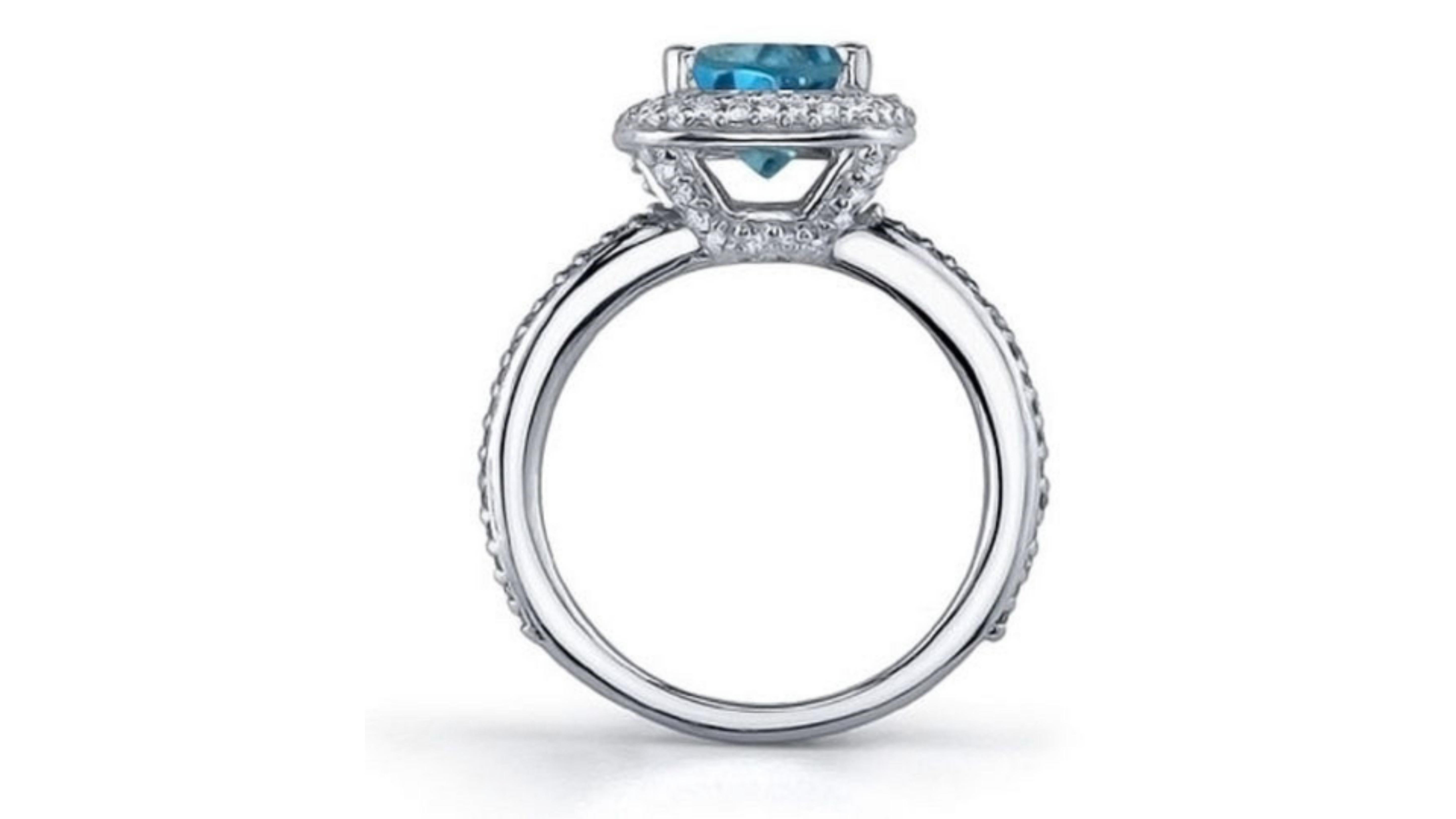 
Blue Diamond Ring 18k White Gold.  These can be hard  to find and stand out well too with 45 diamonds around the centre stone. 

 These comes from  mines include the Cullinan mine near Pretoria, South Africa, and the Argyle mine in Australia. Once,