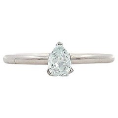 Blue diamond pear shaped solitaire engagement ring 18k white gold