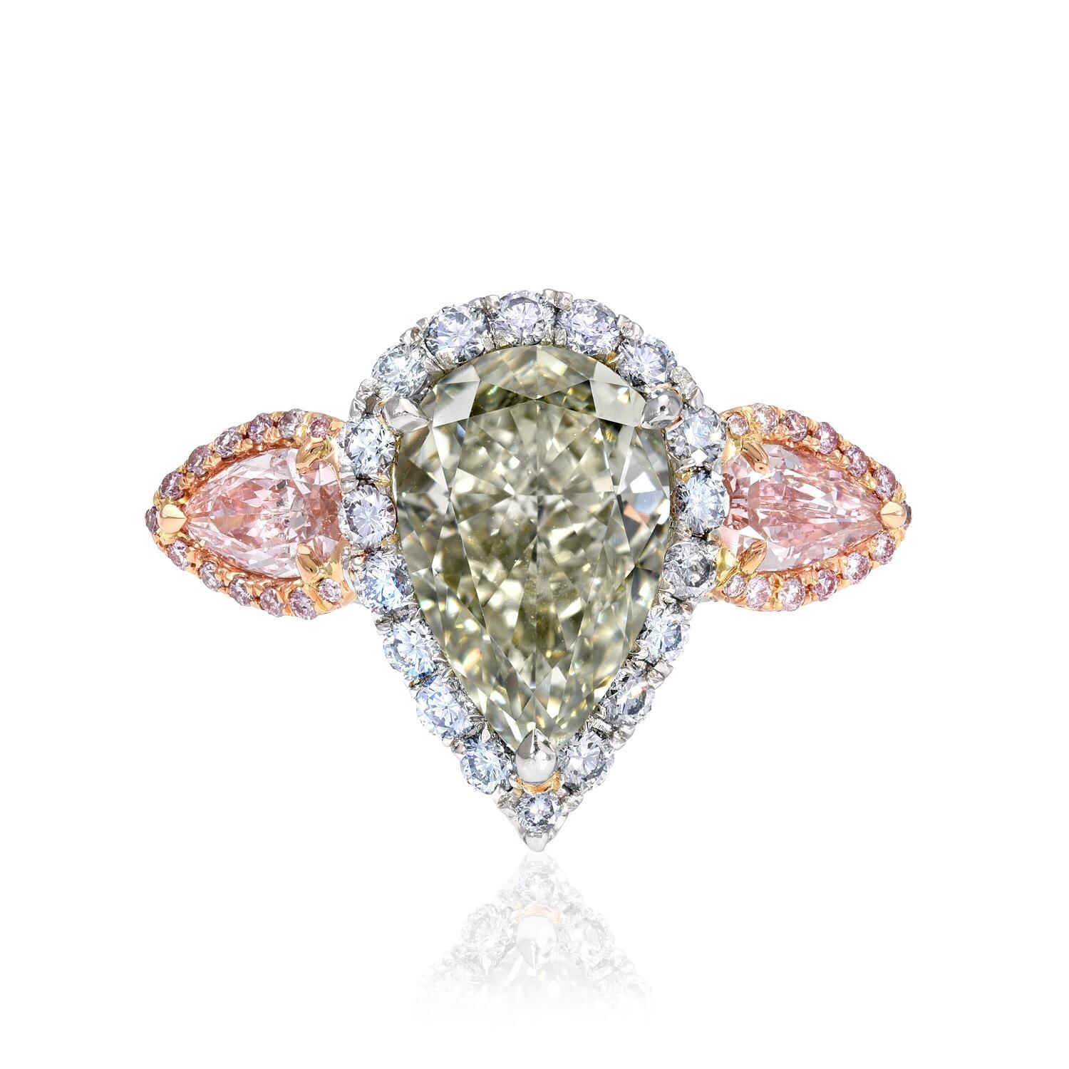 Ultra rare and exclusive 5.16 carat natural Fancy deep grayish yellowish Green pear shape diamond, VS2 clarity, surrounded by natural Fancy Blue round brilliant diamonds, flanked by a pair of natural Fancy Pink diamond pear shapes weighing a total