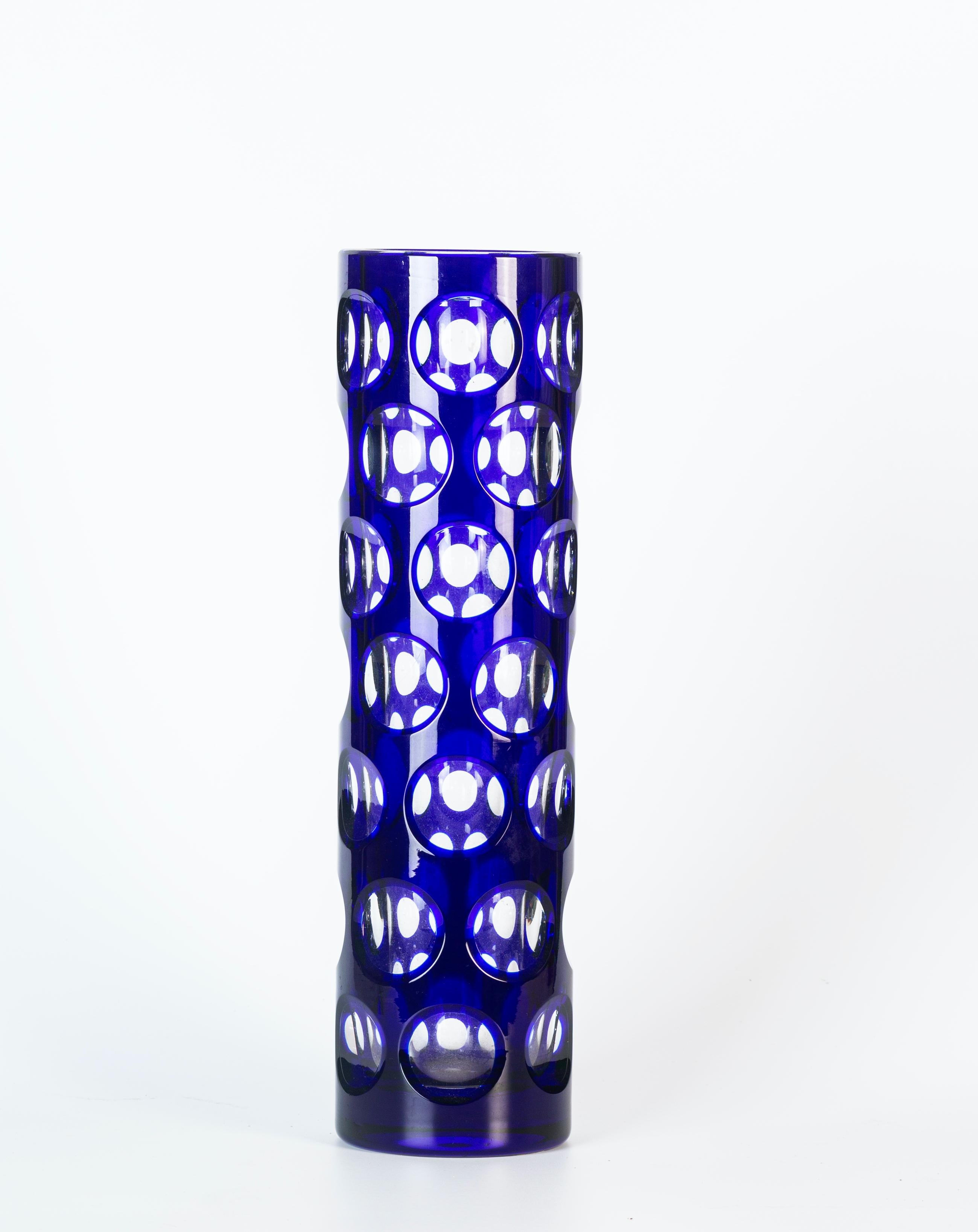 Blue dots glass vase is a wonderful glass decorative object, realized during the 1970s. 

Very beautiful glass vase decorated on surface with dots. Blue colored base.

Good conditions.