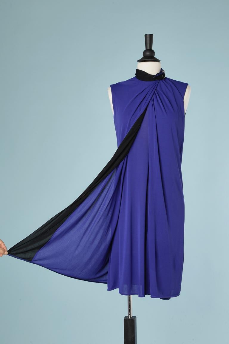 Blue double lays jersey wrap dress with belt around the neck.
SIZE 38 (M) 