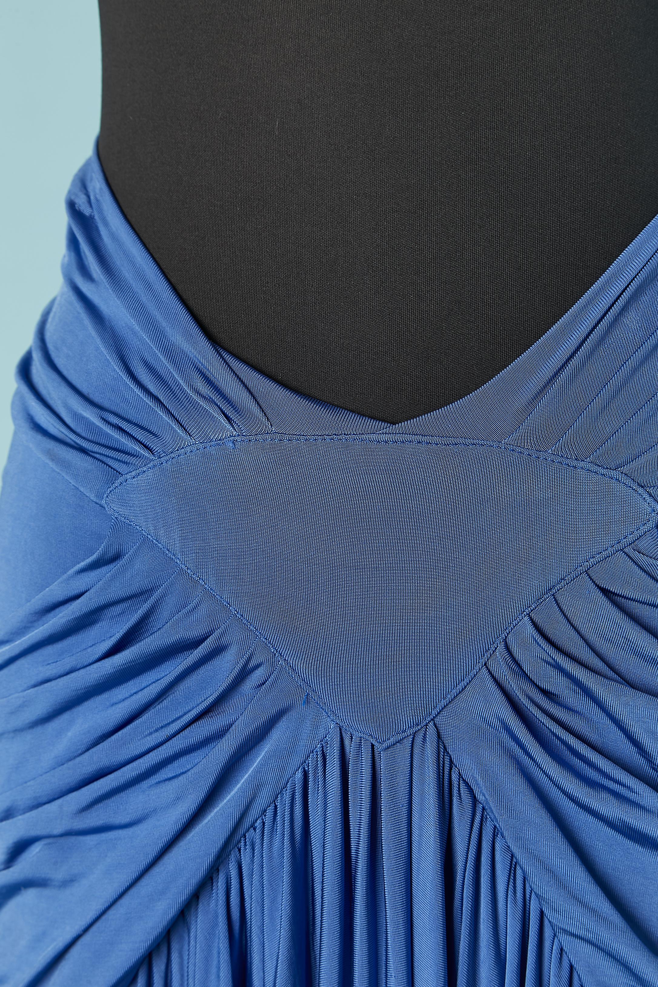 Blue draped rayon jersey skirt. Zip in the middle back with branded zip puller. Pocket on both side. 
SIZE 38 (Fr) 