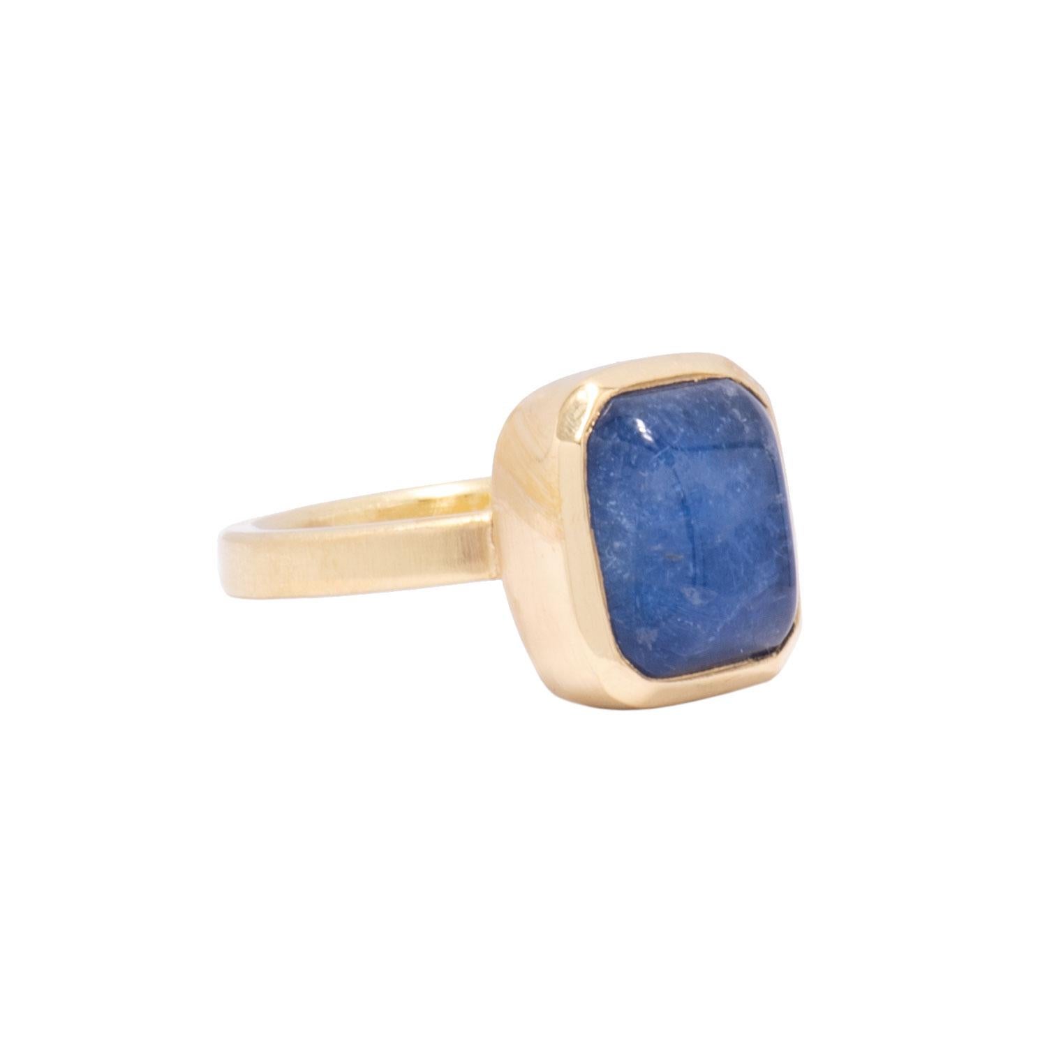 A cushiony Blue Dumortierite Quartz cabochon is bezel set in 18 karat gold like a denim pillow. A simple setting enhances and highlights the intense blue and the cabochon cut displays the subtle streaks of color within. Hand crafted in our studio,