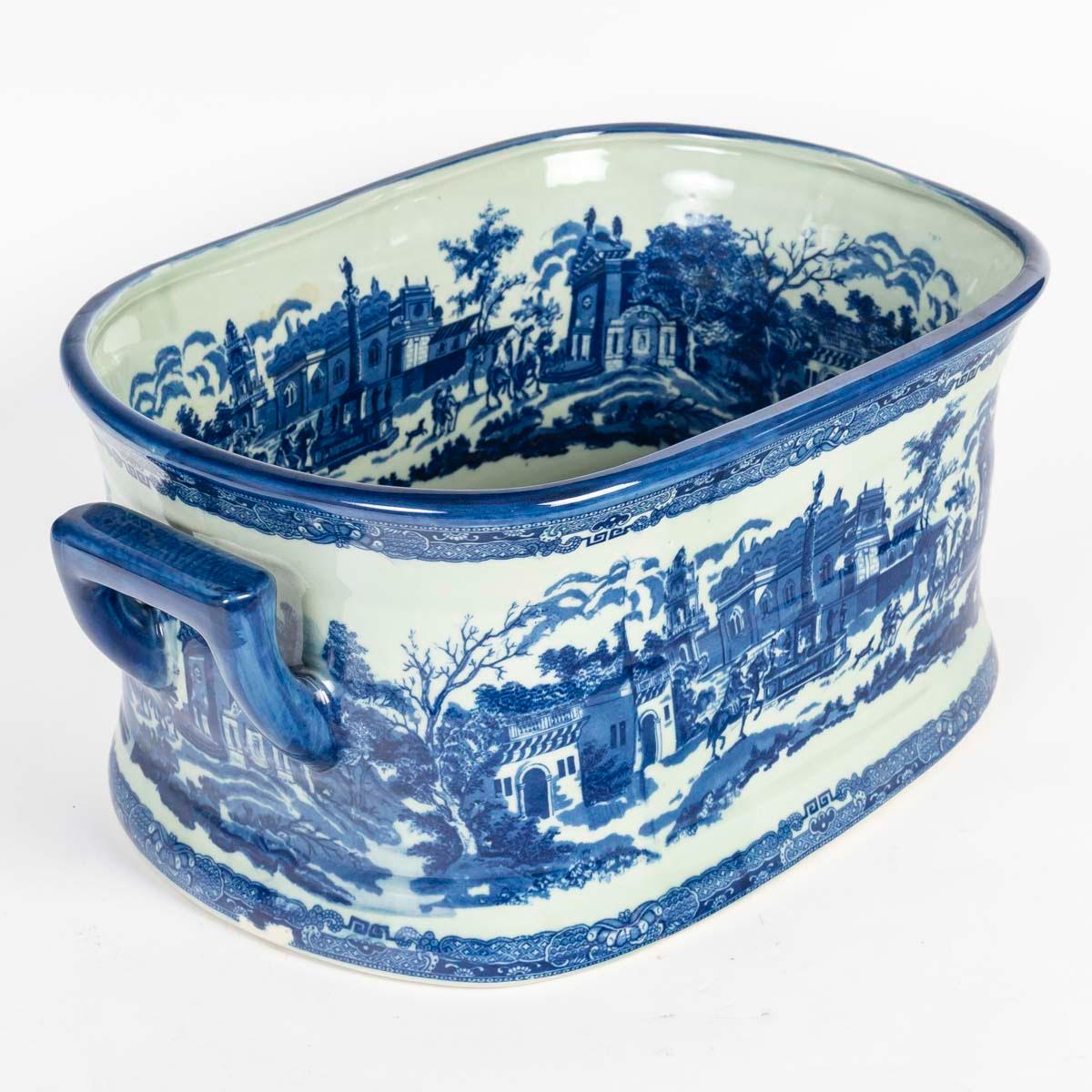 Blue earthenware planter, signed Victoria Ware, 20th century.

Victoria Ware blue earthenware planter, decorated with monuments and city scenes, early 20th century.
H: 21cm, W: 48cm, D: 29.5cm