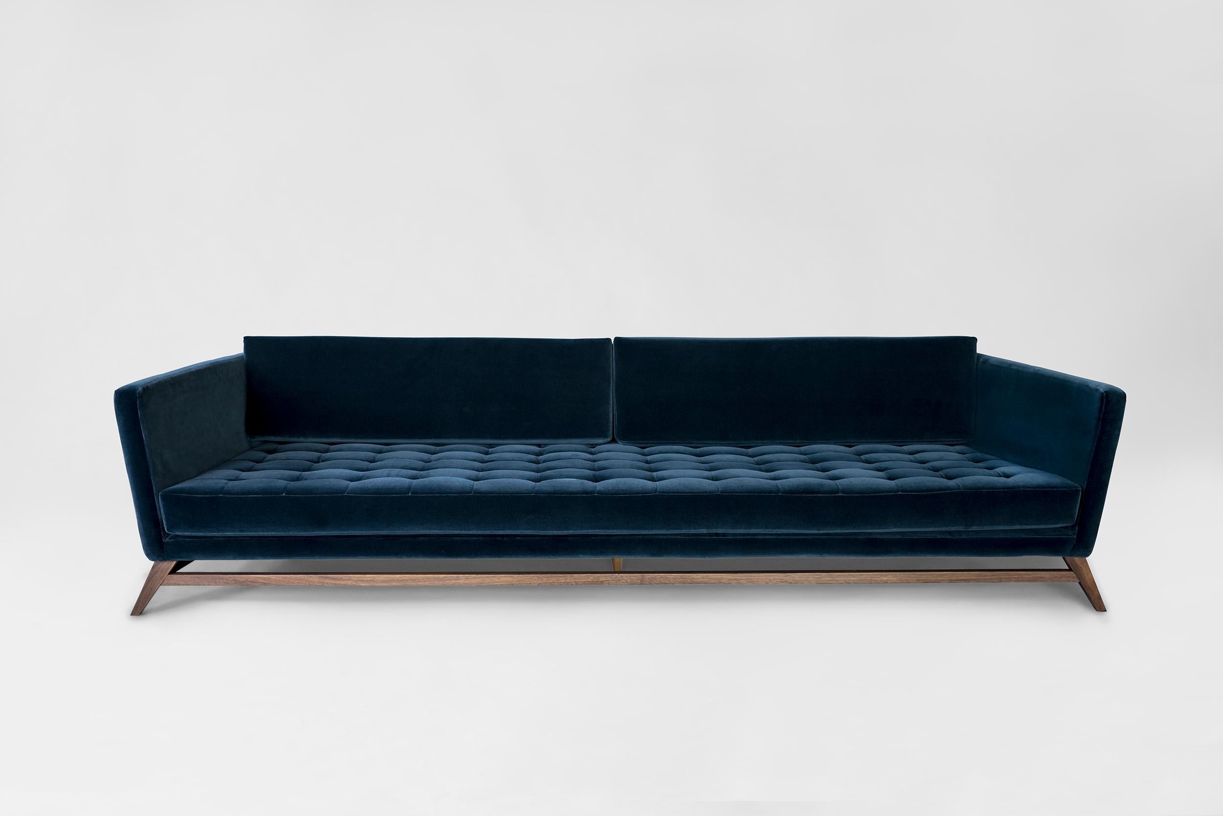 Blue Eclipse sofa by Atra Design.
Dimensions: D 220 x W 108.8 x H 79 cm.
Materials: fabric, walnut wood.
Available in other colors.

Atra Design
We are Atra, a furniture brand produced by Atra form a mexico city–based high end production facility