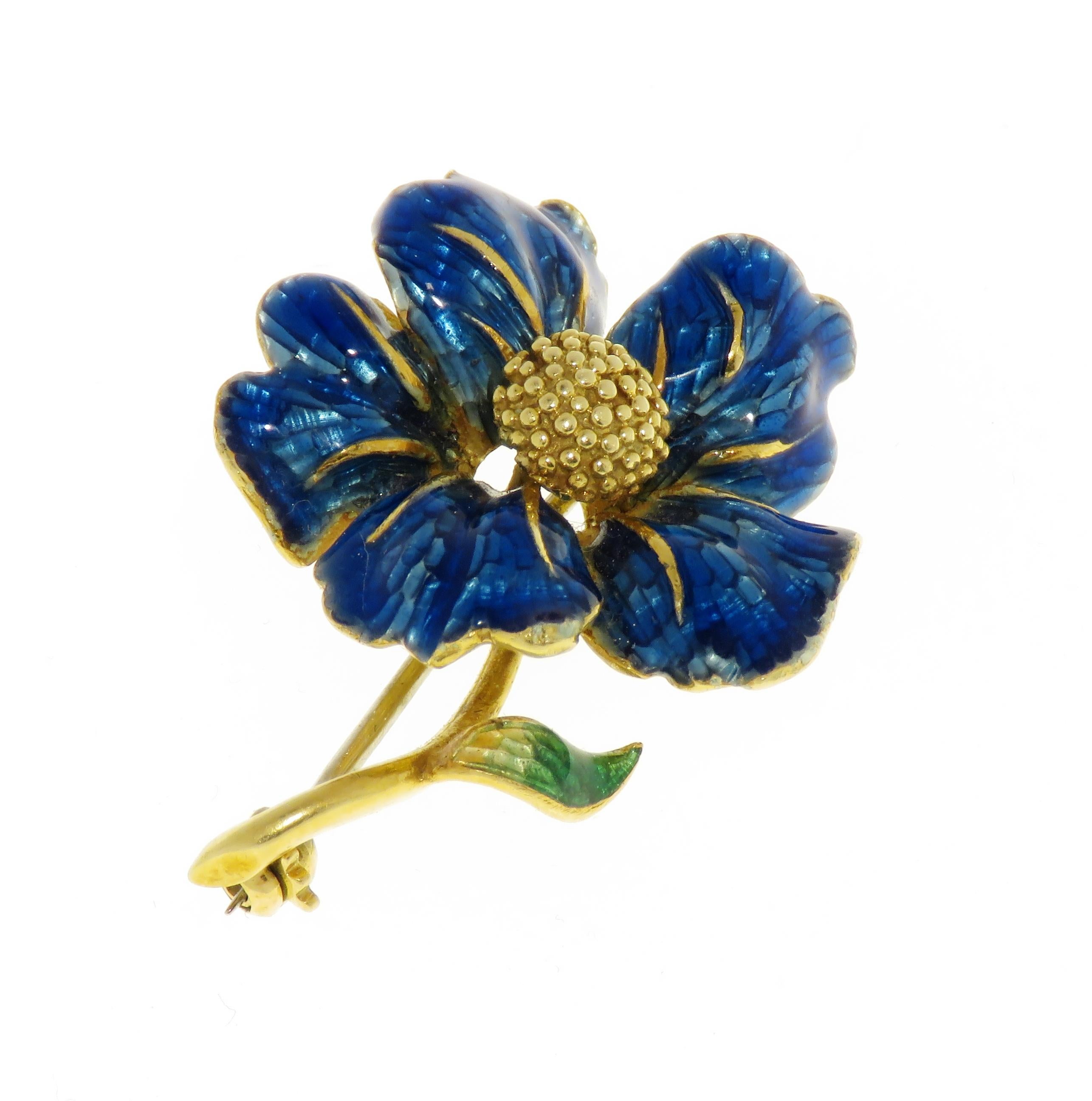 Enchanting vintage brooch featuring a blue flower with blue and green enamel handmade in 18 karat yellow gold. The size of the brooch is 26X38mm / 1.023x1.496 inches. Marked with the Italian gold mark 750.

Handcrafted in: 18 karat yellow gold.
Size