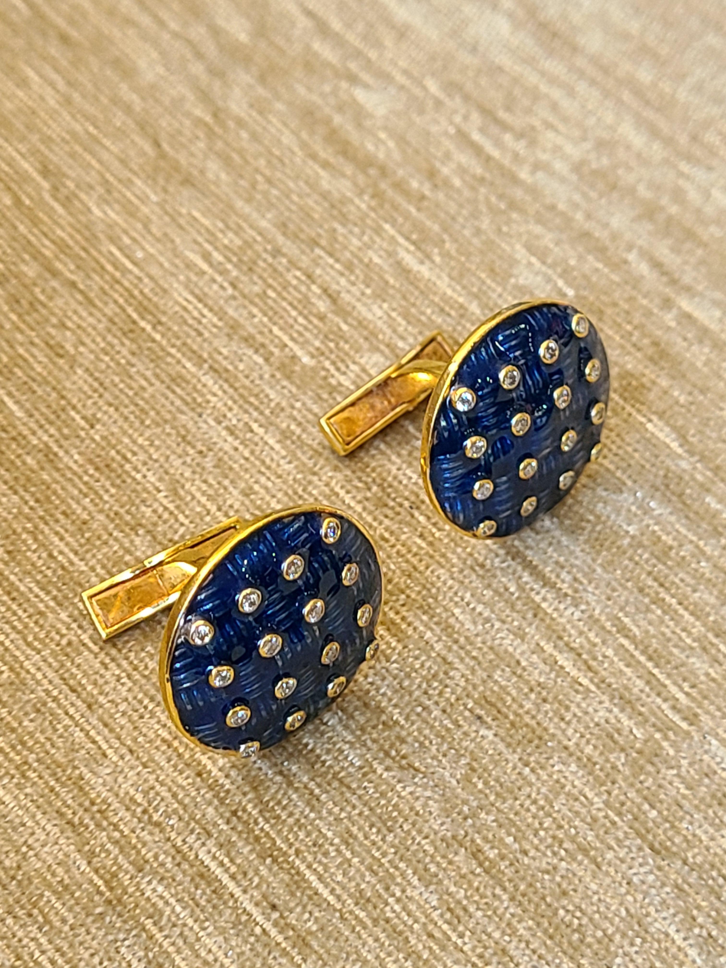 A pair of gorgeous cufflinks set in 14k yellow gold with natural diamonds and high finish blue enamel. The diamond weight is .25 carats and net gold weight is 15.39 grams. The cufflinks dimensions in cm 2.1 x 2.1 x 1.9 (LXWXD).
