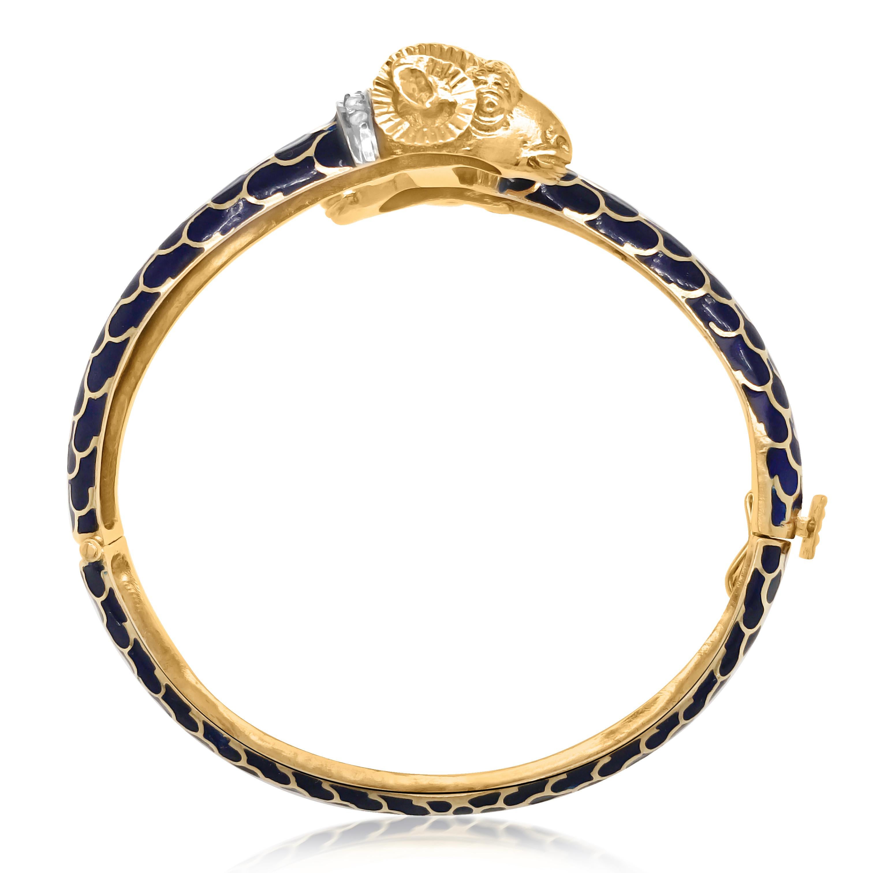 This stunning vintage blue enamel 18K yellow gold bangle has fabulous textured and lively crafted double lamb's heads, with 5 diamonds on each neck. This bangle is covered with the golden python pattern and filled with beautiful blue enamel,