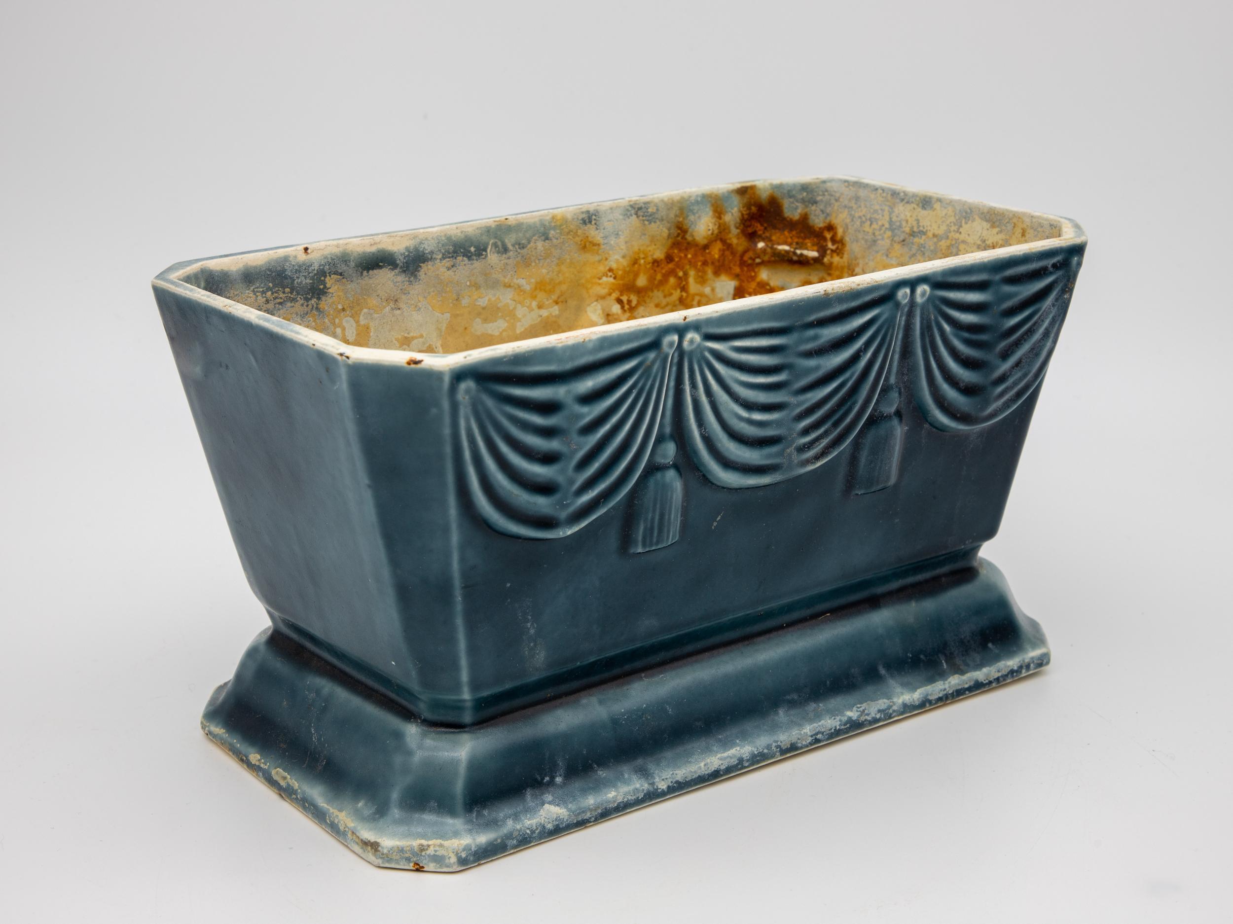 Blue enamel cast iron cachepot with beautiful relief swag detail. Beautiful for an accent on a sideboard or a planter in your sunroom or porch.