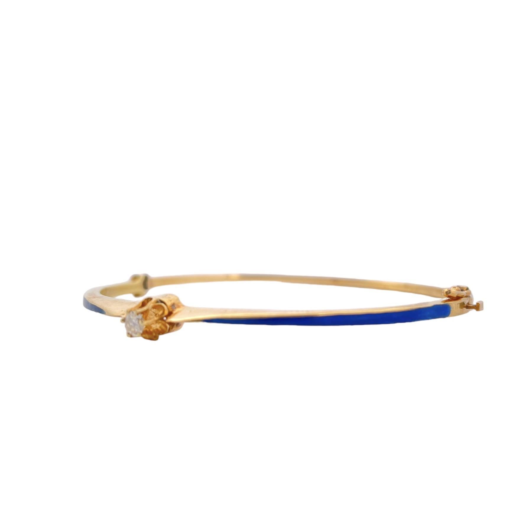 Indulge in the timeless charm of our Blue Enamel Diamond Bangle, a masterpiece that effortlessly combines the brilliance of diamonds with the vibrant allure of blue enamel. This exquisite bangle is crafted in gleaming 14K yellow gold and adorned