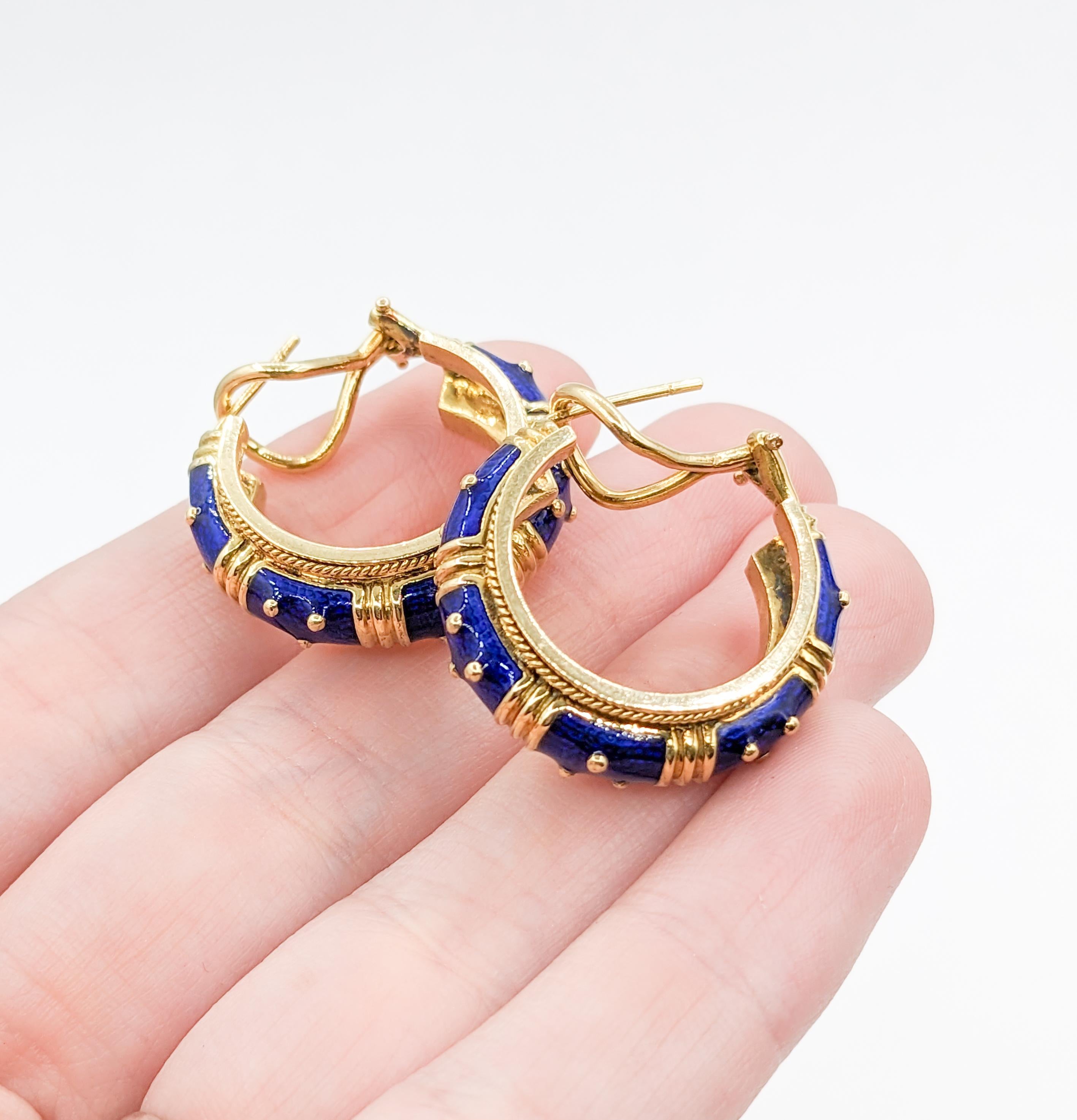 Vibrant Blue Enamel Hidalgo Hoop Omega Earrings

Elevate your style with these Hidalgo hoop earrings! These enchanting earrings, intricately crafted in 18k yellow gold with 14k omega backs, showcase mesmerizing blue enamel with a signature Hidalgo